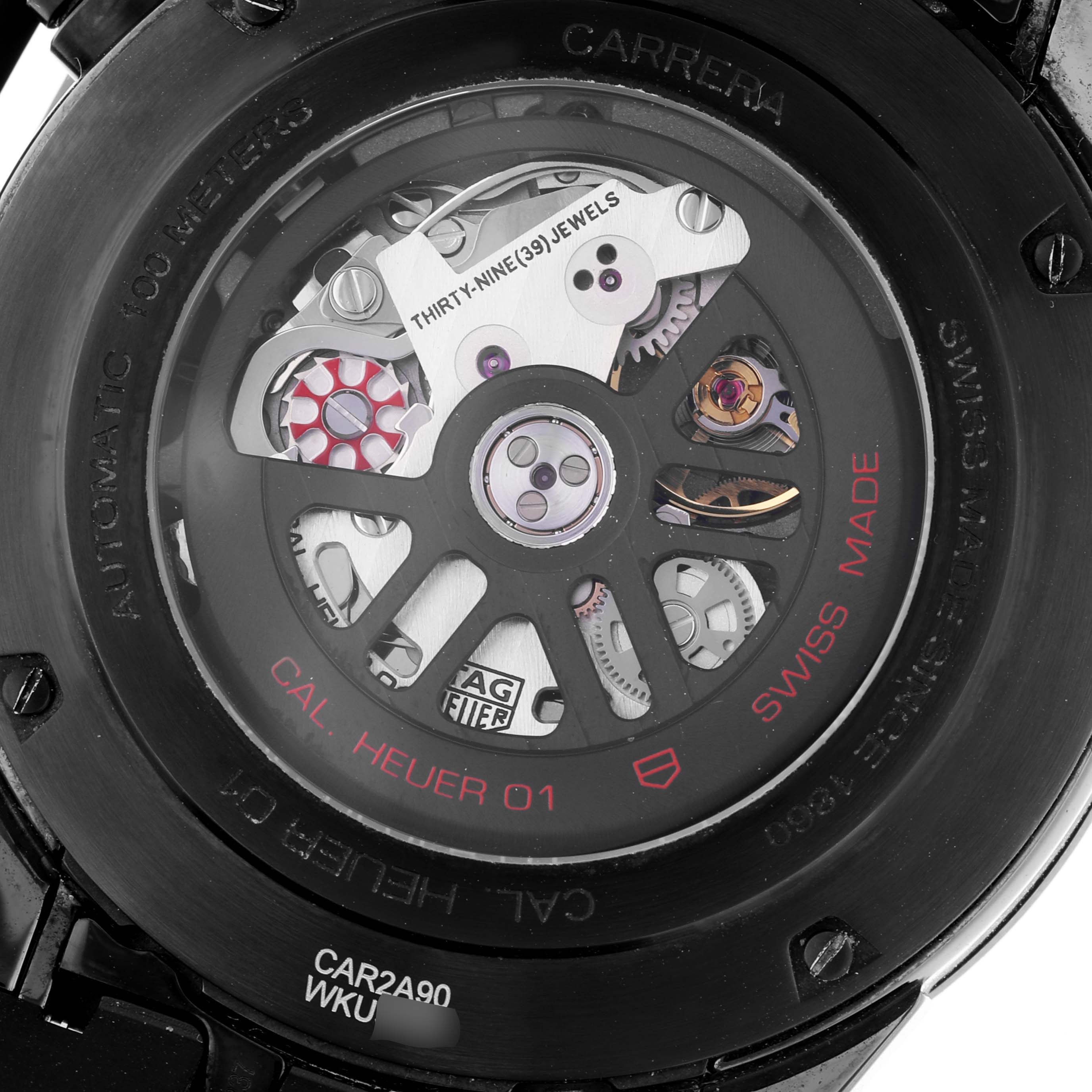 This image shows the back view of a Tag Heuer Carrera CAR2A90.FT6071 Men's Ceramic Black Dial CAR2A90.FT6071 Men's Ceramic Black Dial watch, revealing the internal mechanism and "Cal. Heuer 01" movement.