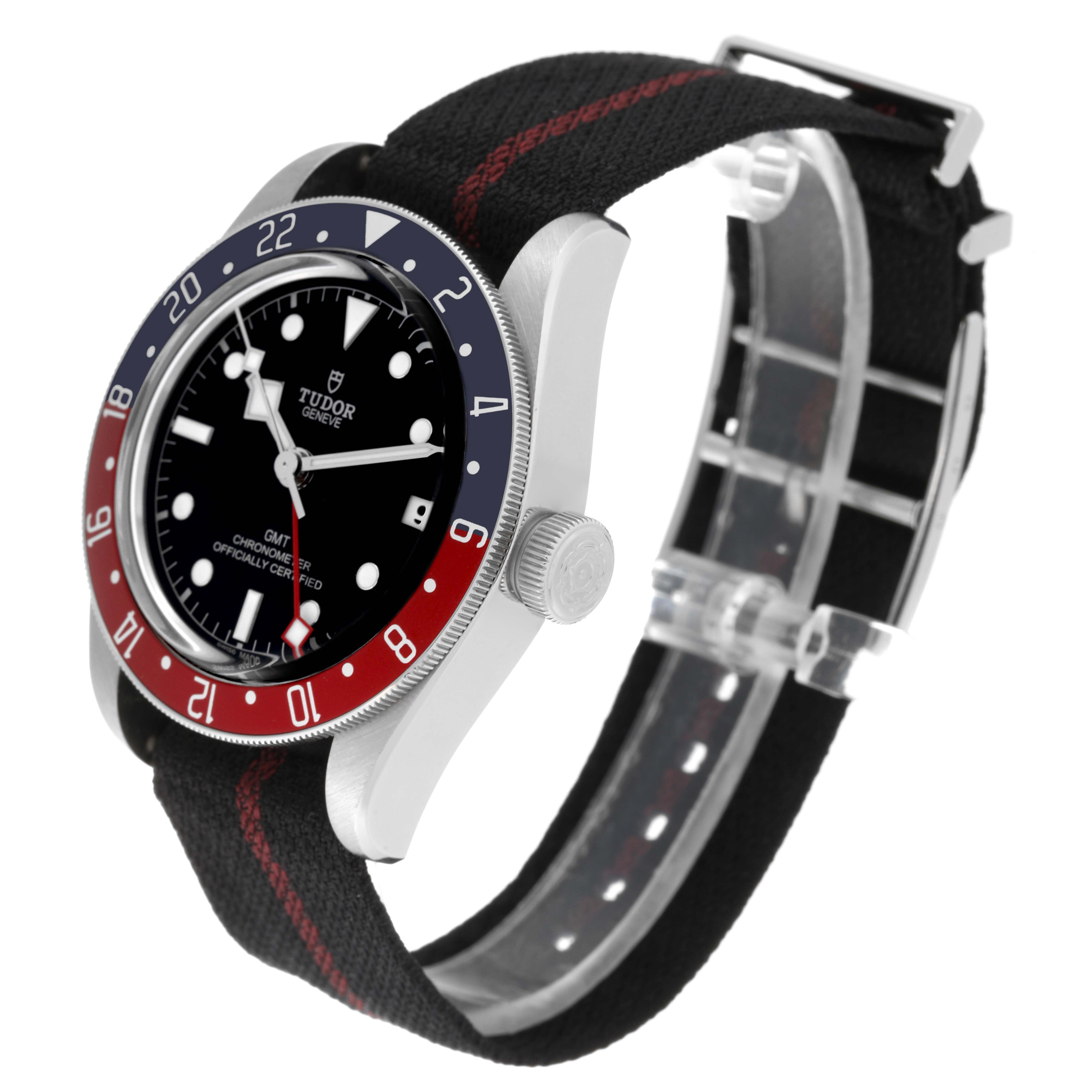 The Tudor Heritage Black Bay 79830RB Men's Stainless Steel Black Dial 79830RB Men's Stainless Steel Black Dial watch is shown at a three-quarter angle, highlighting its bezel, dial, crown, and fabric strap.