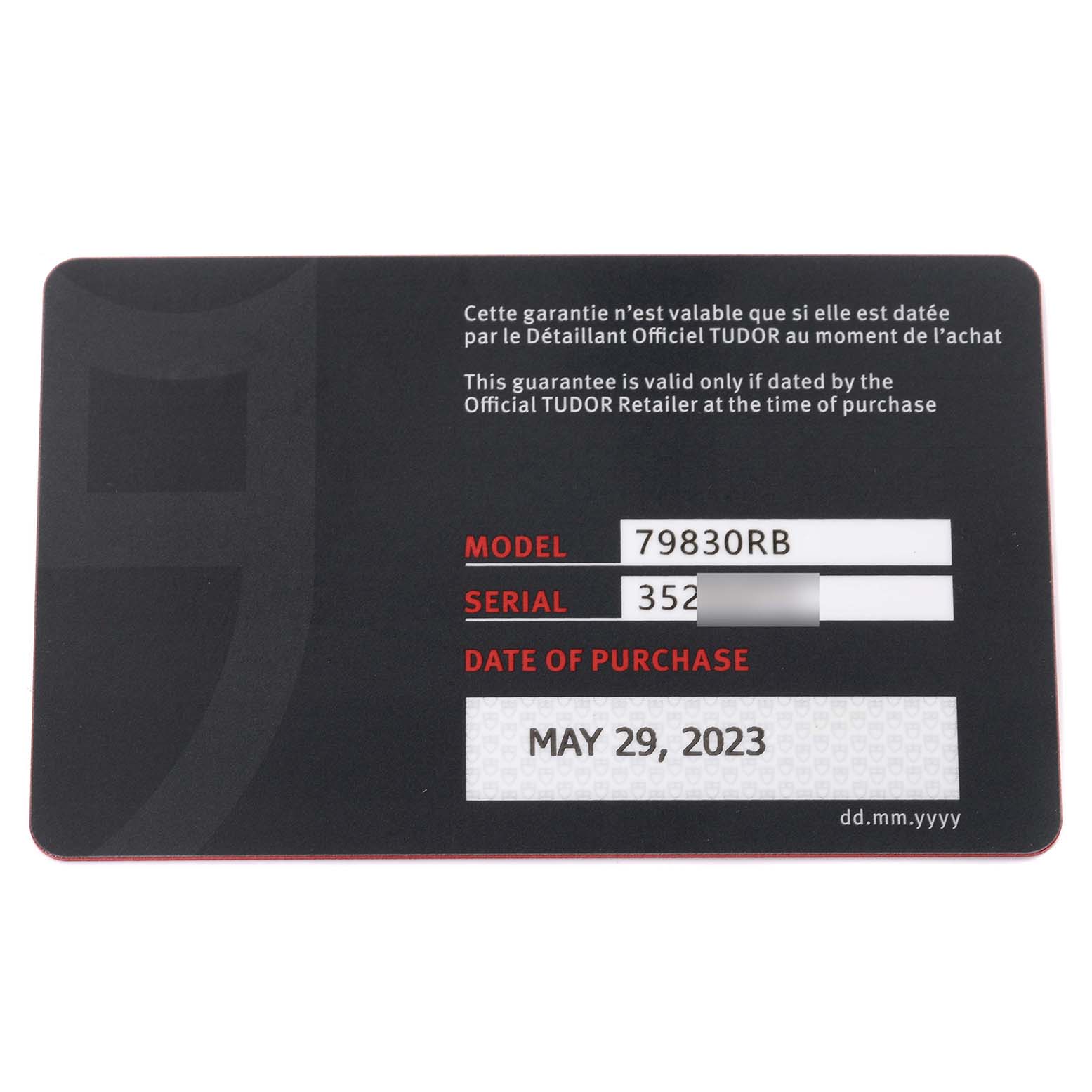 This is a warranty card for the Tudor Heritage Black Bay 79830RB Men's Stainless Steel Black Dial 79830RB Men's Stainless Steel Black Dial model 79830RB, showing the serial number and date of purchase.