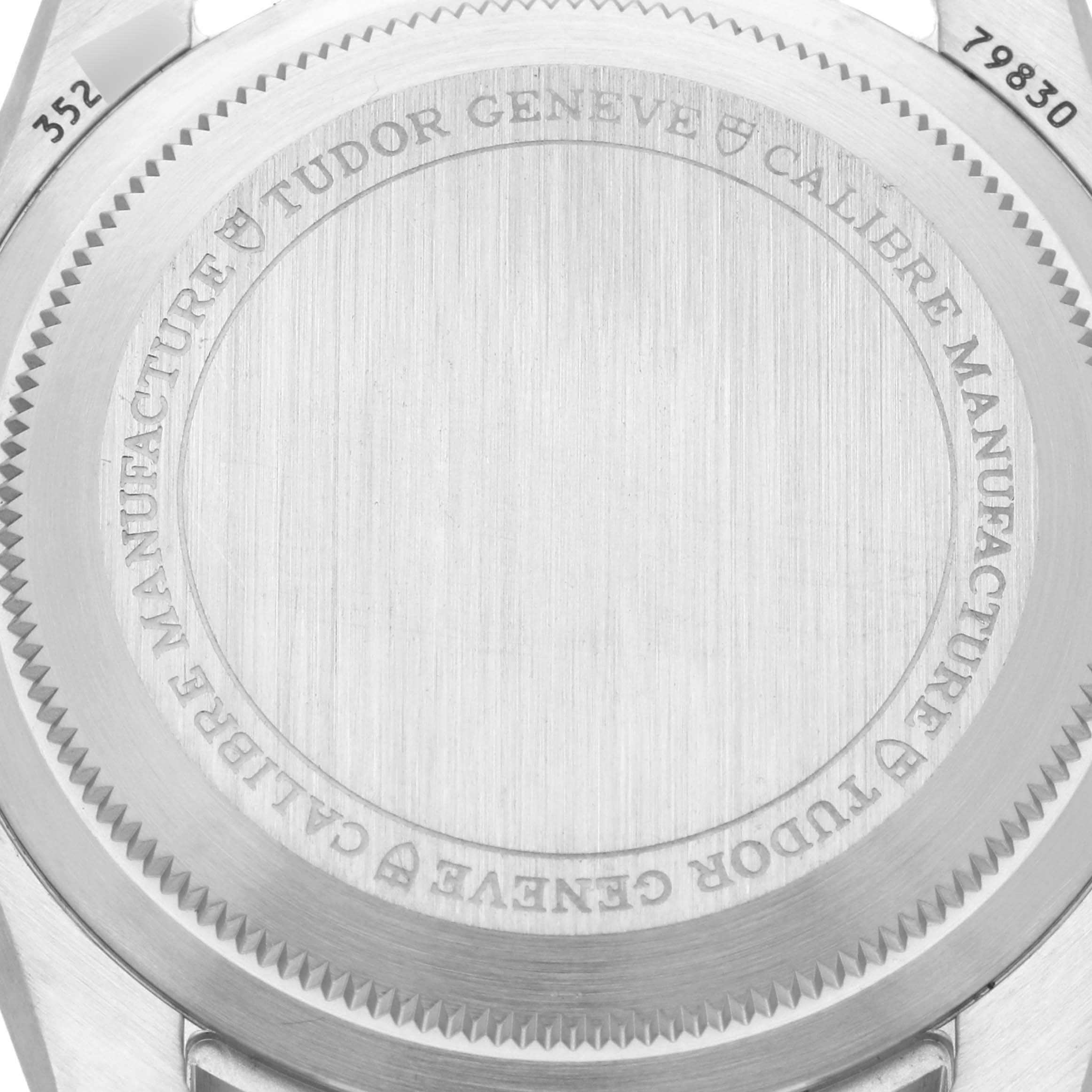 The image shows the case back of the Tudor Heritage Black Bay 79830RB Men's Stainless Steel Black Dial 79830RB Men's Stainless Steel Black Dial watch from a top-down angle.