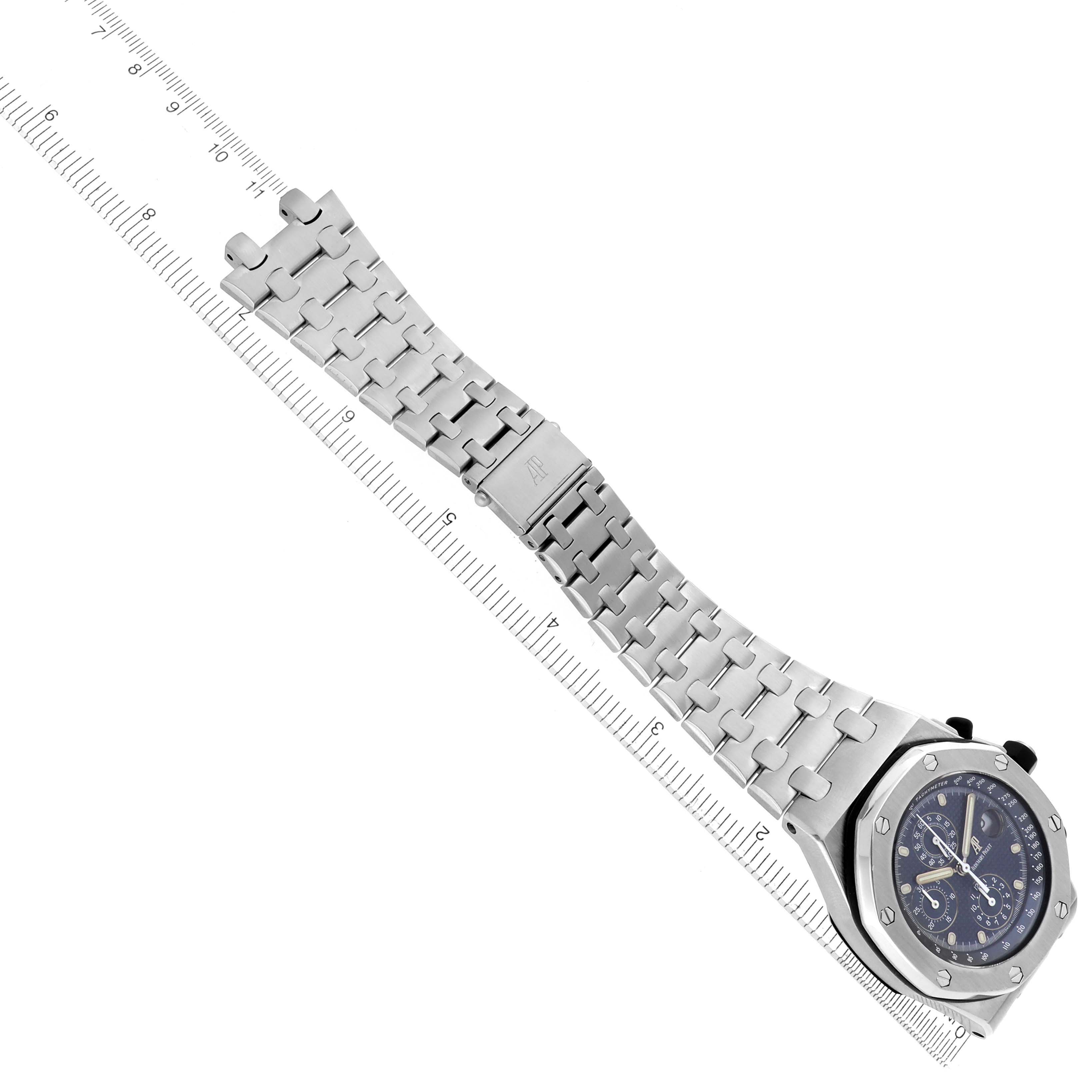 The image shows the Audemars Piguet Royal Oak Offshore 25721ST watch from a top-down angle, highlighting the entire bracelet and a partial view of the watch face beside a ruler.