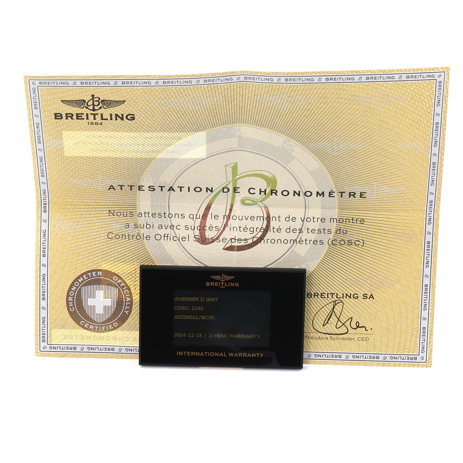 The image shows a certificate and an international warranty card for the Breitling Avenger model A32390.