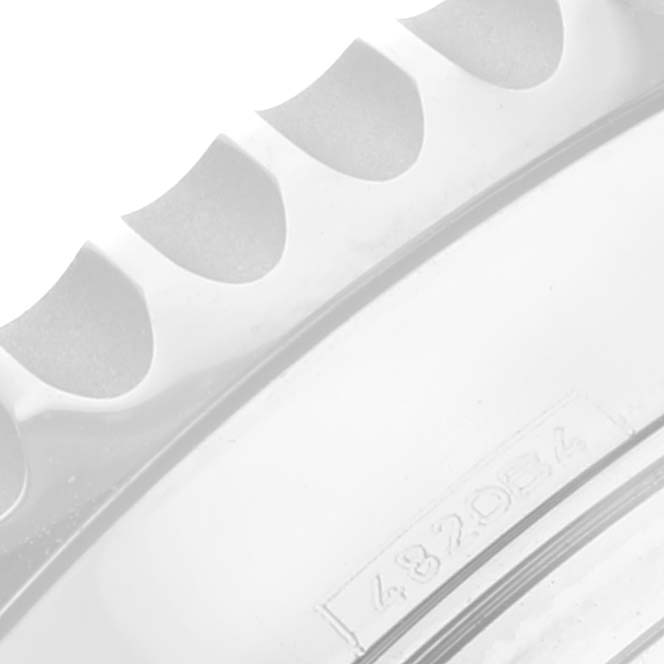 Close-up of the bezel and part of the casing of a Breitling Navitimer AB0121 Men's Stainless Steel Mother of Pearl Dial AB0121 Men's Stainless Steel Mother of Pearl Dial watch.