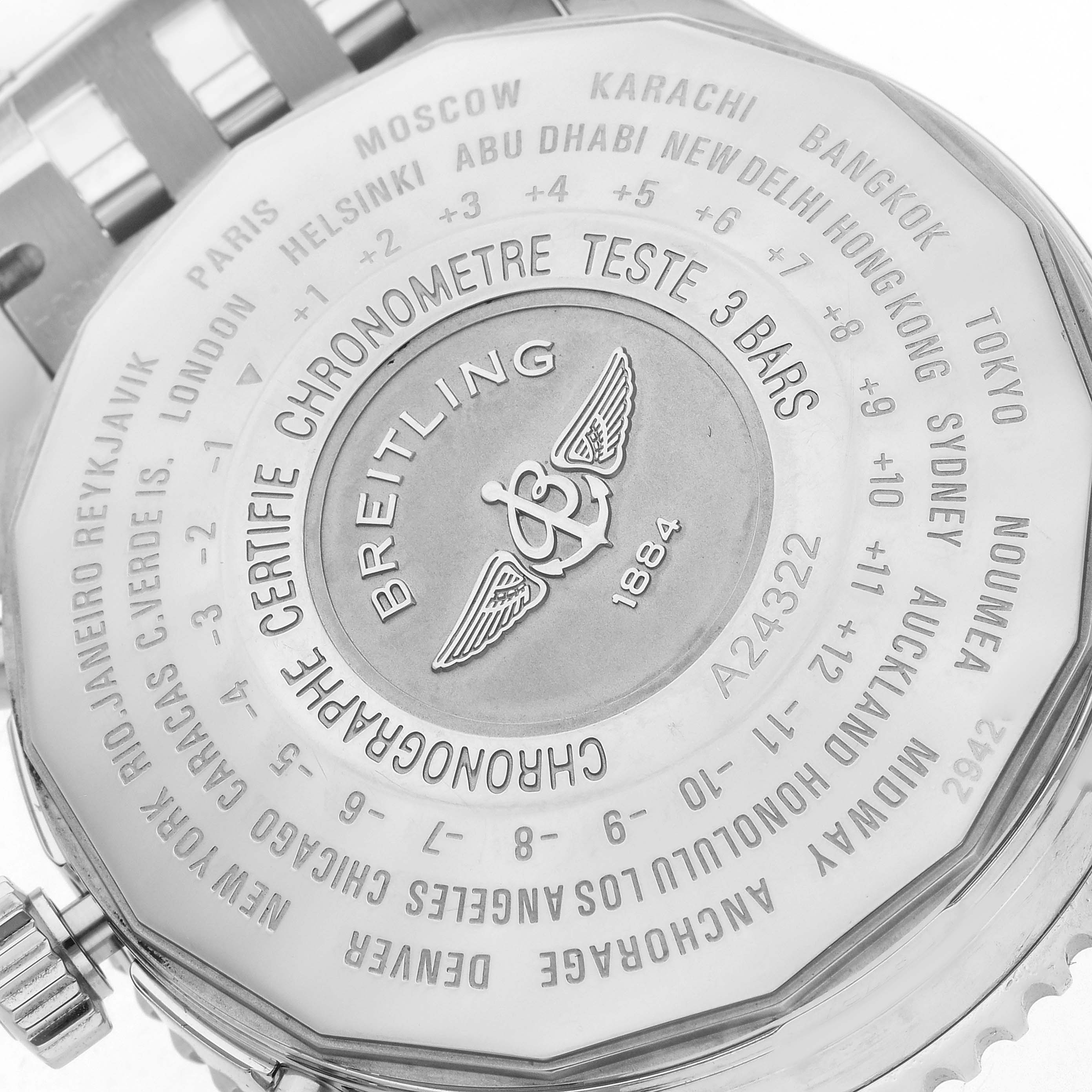 The image shows the back of a Breitling Navitimer model A24322 men's watch, featuring an engraved world time scale and the Breitling logo.