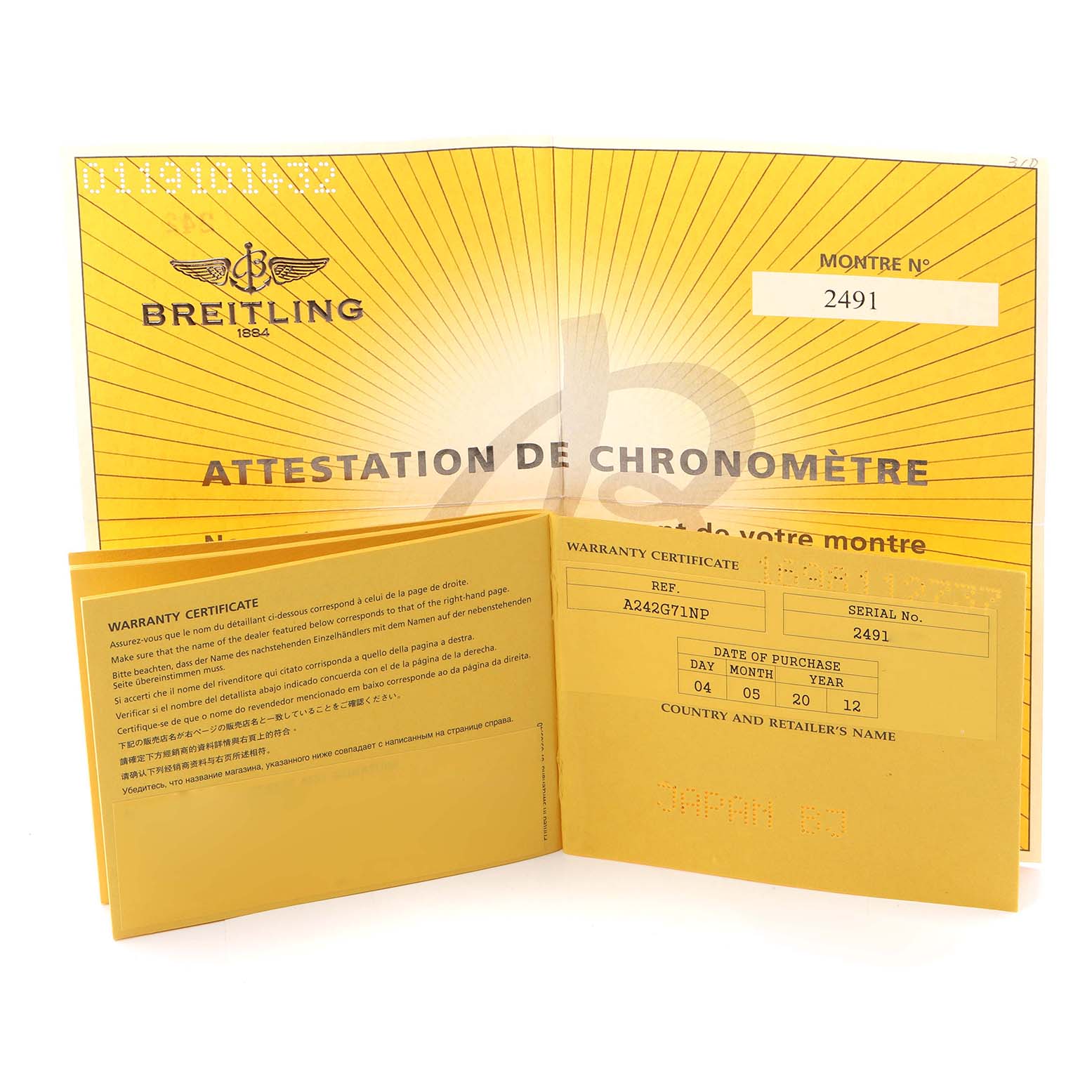 The image shows the warranty certificate and chronometer attestation for the Breitling Navitimer model A24322.