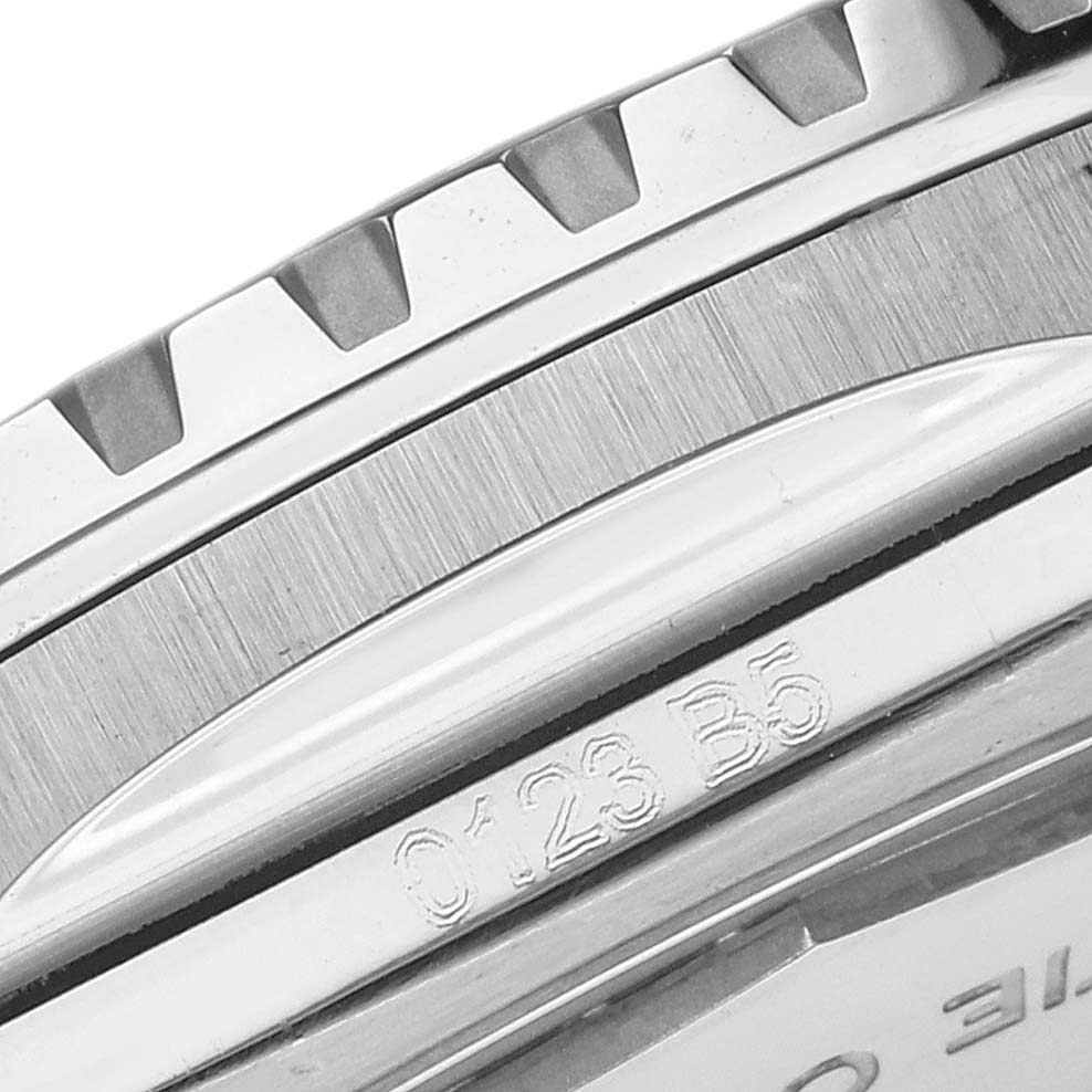 The image shows a close-up side view of the bezel and partial case back of the Breitling Superocean model A17376 mens watch, highlighting its engraved markings.