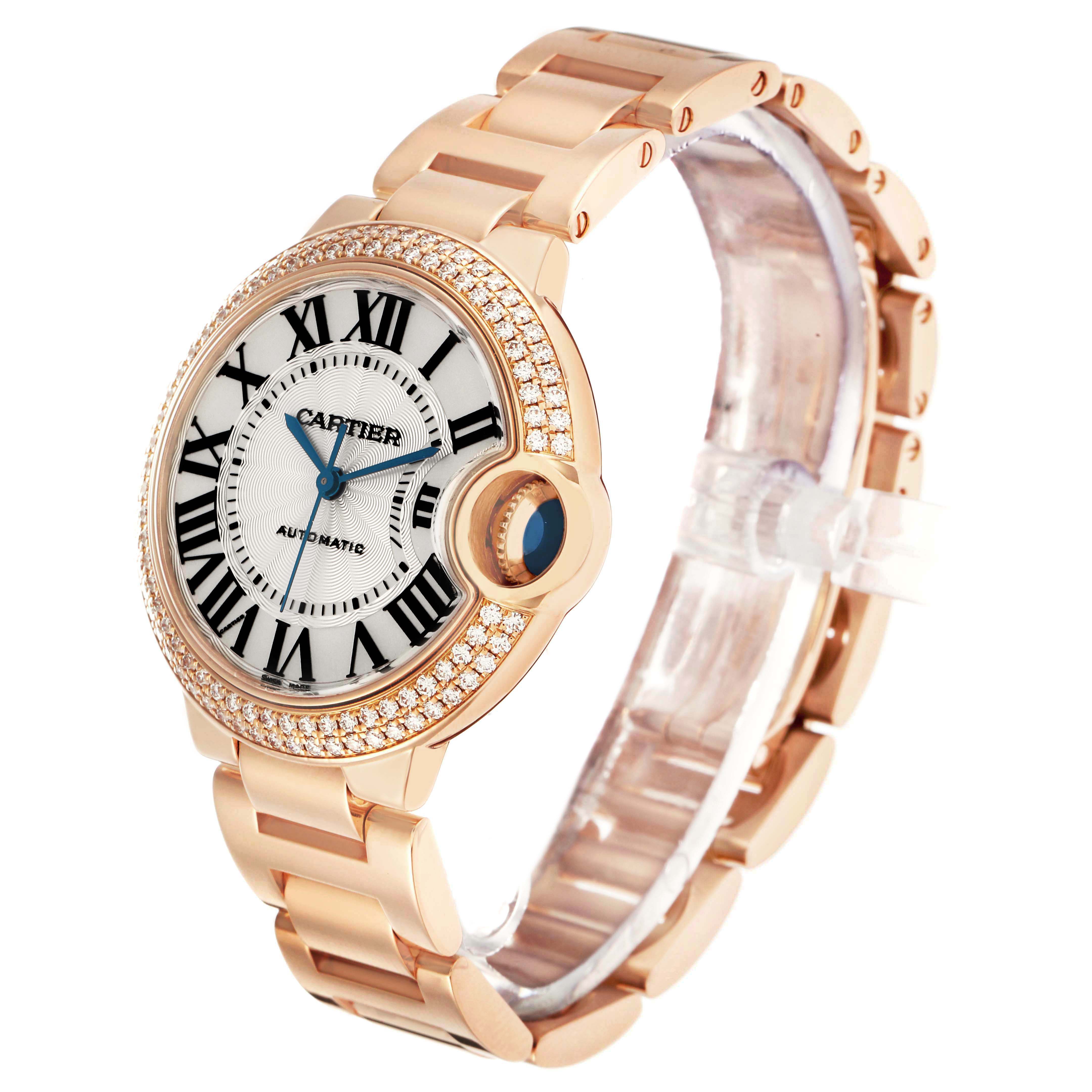 The Cartier Ballon Bleu WE902034 Women's Rose Gold Silver Dial watch is shown at an oblique angle, highlighting the face, bezel, and bracelet.