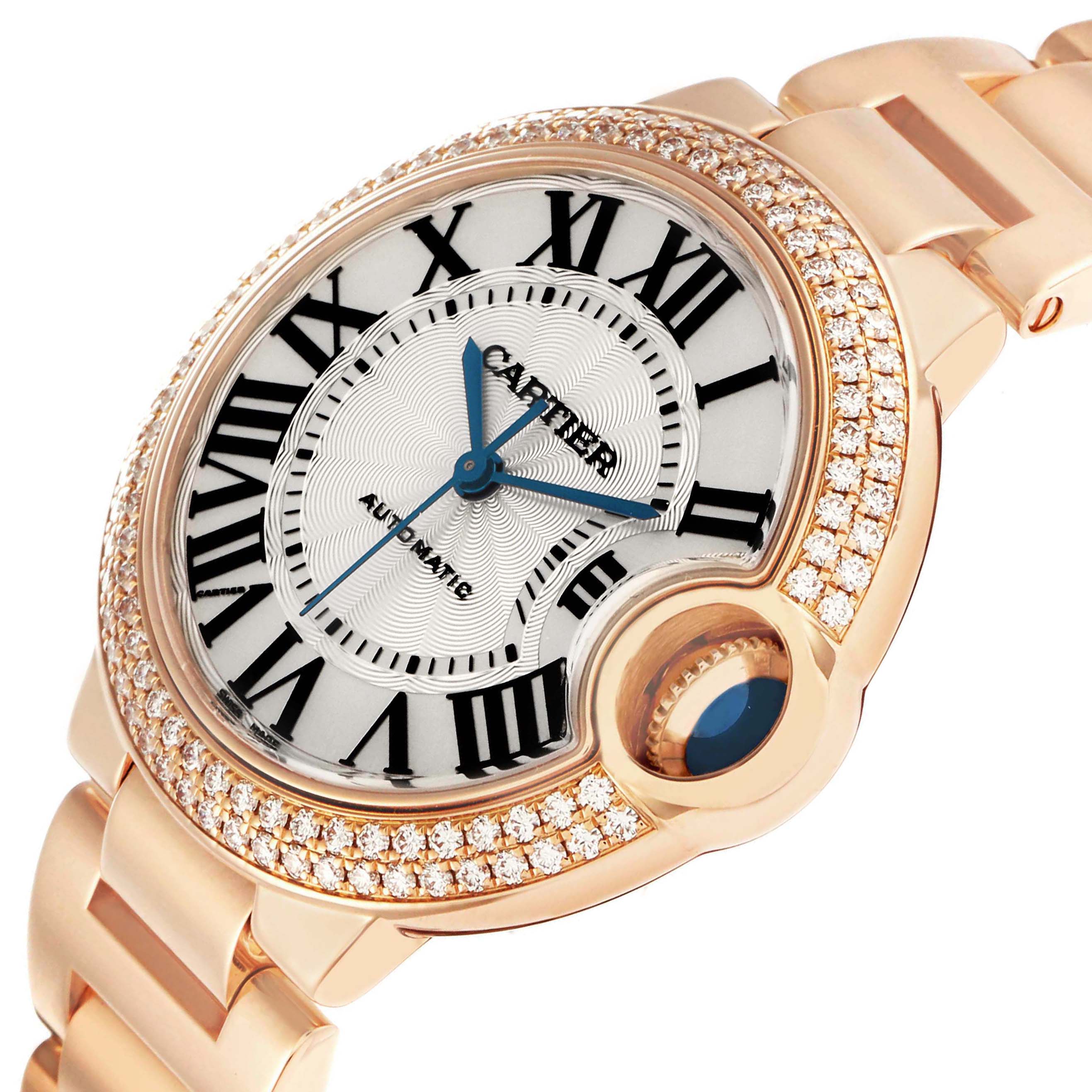 The Cartier Ballon Bleu WE902034 Women's Rose Gold Silver Dial watch is shown at a slight angle highlighting its diamond-studded bezel and round face.