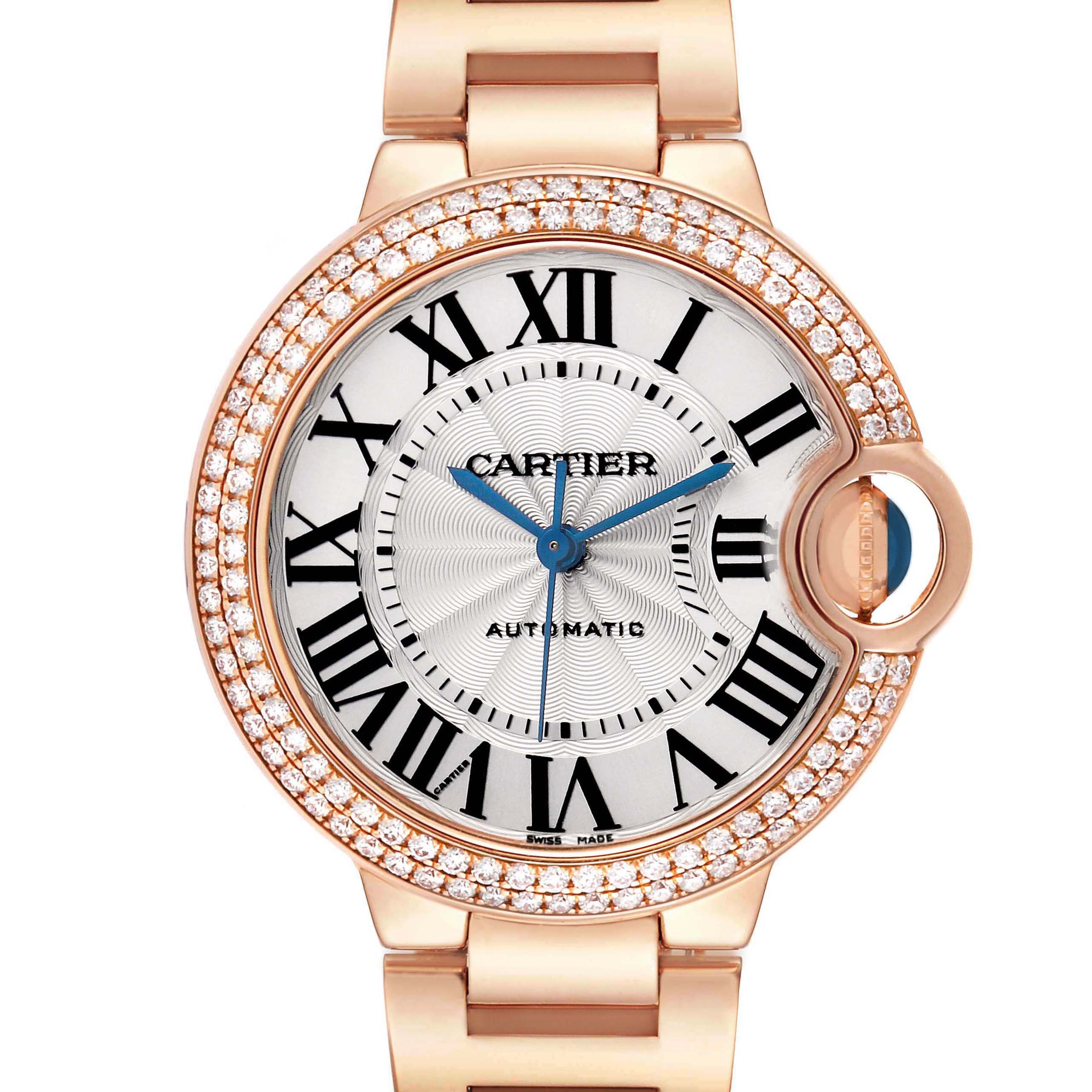 The Cartier Ballon Bleu WE902034 Women's Rose Gold Silver Dial watch is shown from the front, displaying its face, Roman numerals, blue hands, and diamond-set bezel.