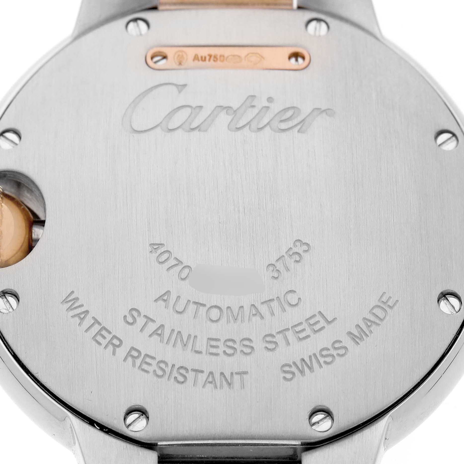 The image shows the back case of a Cartier Ballon Bleu WE902077 Women's Steel and Gold (two tone) Silver Dial watch, highlighting its engravings and metal details.