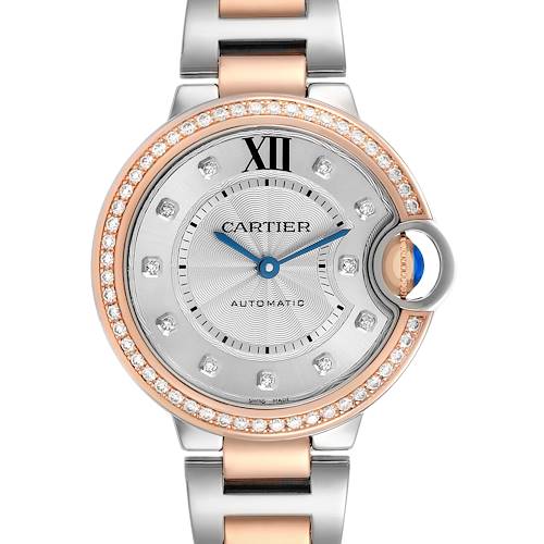 The Cartier Ballon Bleu WE902077 Women's Steel and Gold (two tone) Silver Dial watch is shown from a top view, highlighting its face, bezel, bracelet, and crown.