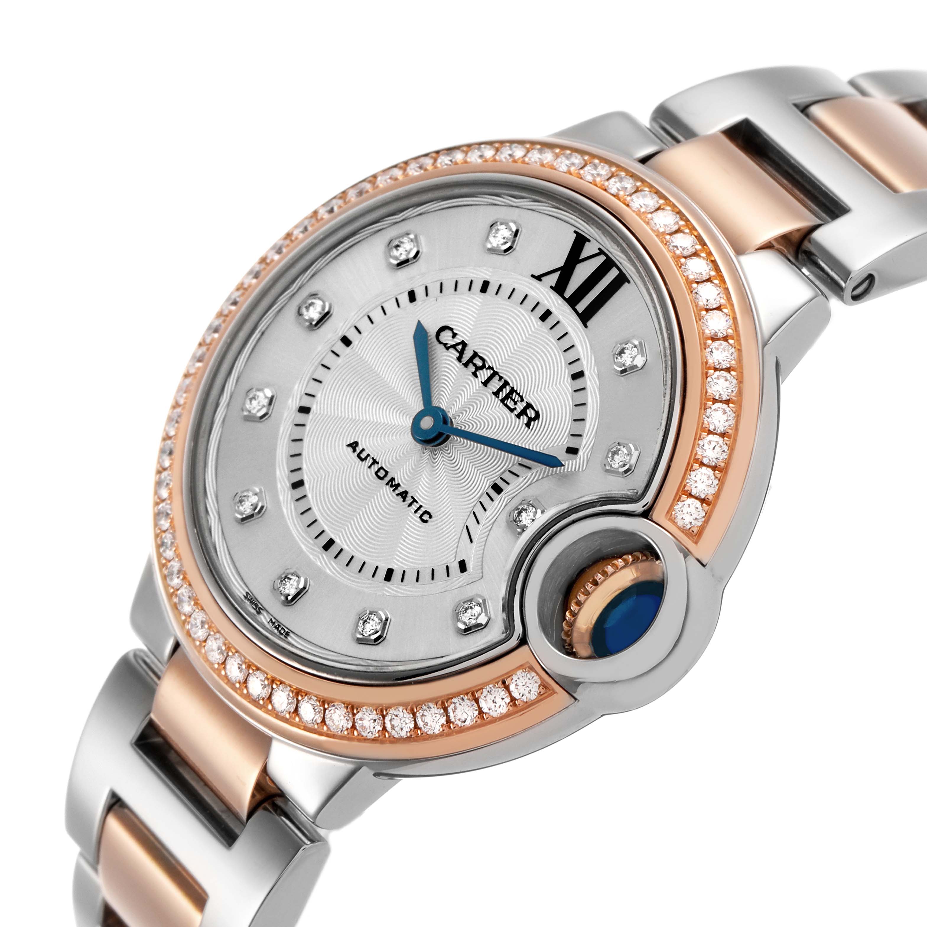 The Cartier Ballon Bleu WE902077 Women's Steel and Gold (two tone) Silver Dial watch is shown at an angled view, highlighting the diamond bezel, Roman numerals, and two-tone bracelet.
