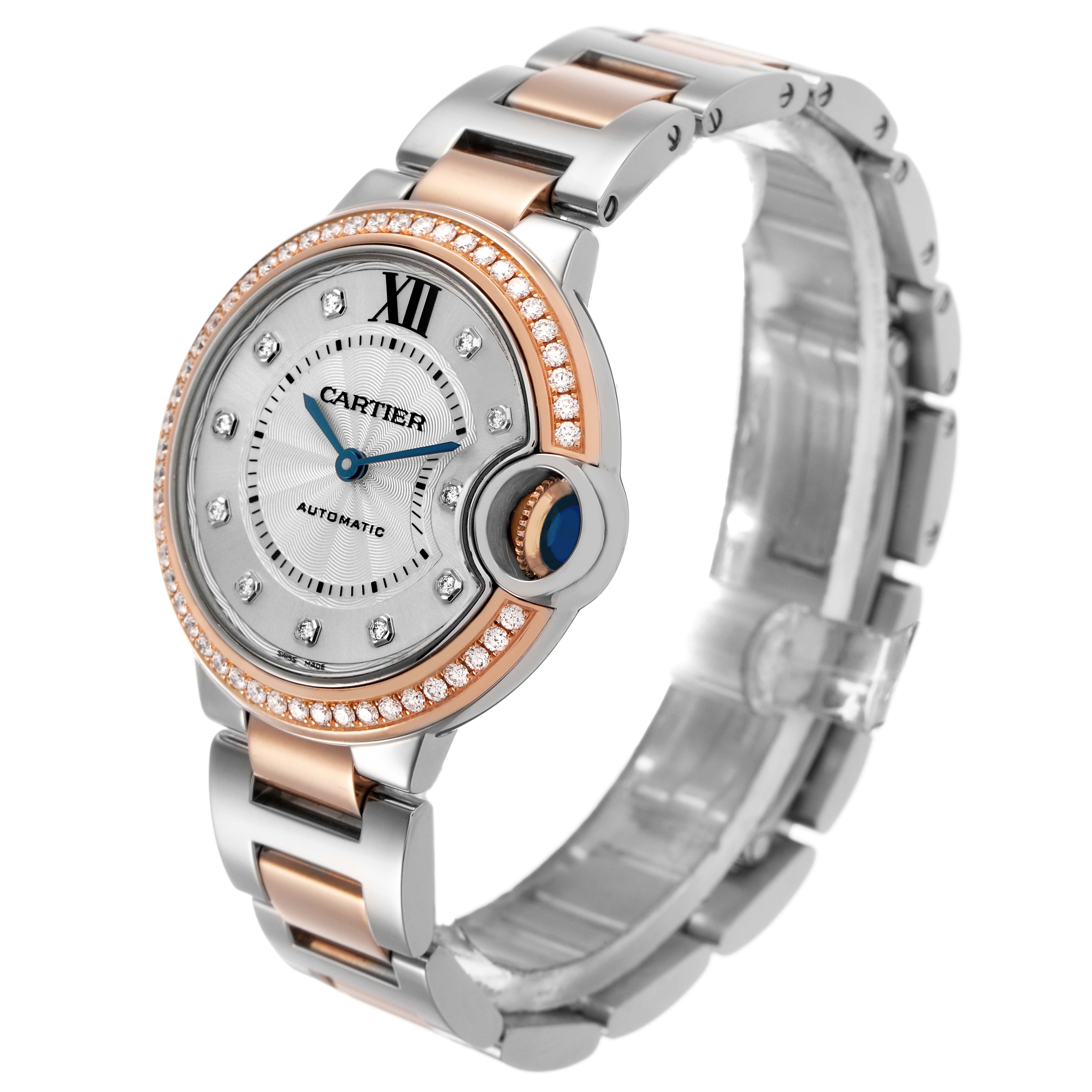 The Cartier Ballon Bleu WE902077 Women's Steel and Gold (two tone) Silver Dial watch is shown at an angled side view, highlighting its face, bracelet, and signature crown.