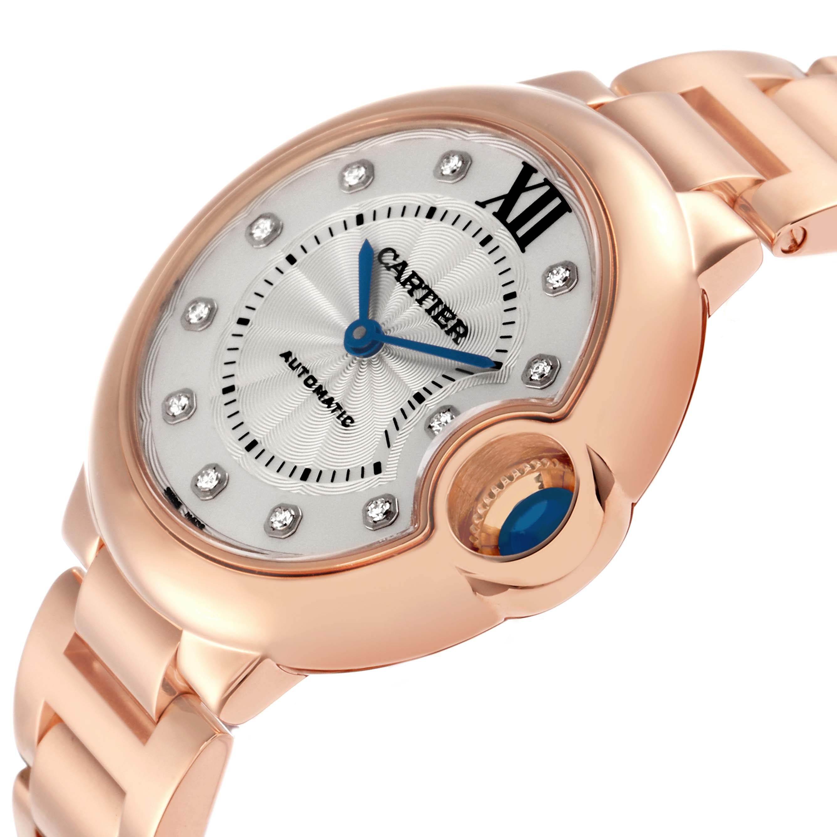The image shows a Cartier Ballon Bleu WE902039 men's watch from an angled top view, highlighting the dial, crown, and part of the bracelet.