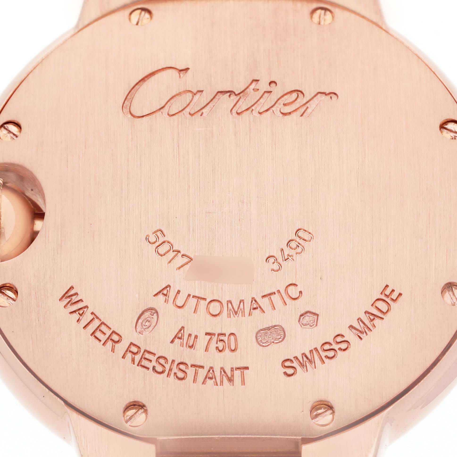 The image shows the back case of a Cartier Ballon Bleu model WE902039 men's watch, displaying engravings and details about water resistance and materials.
