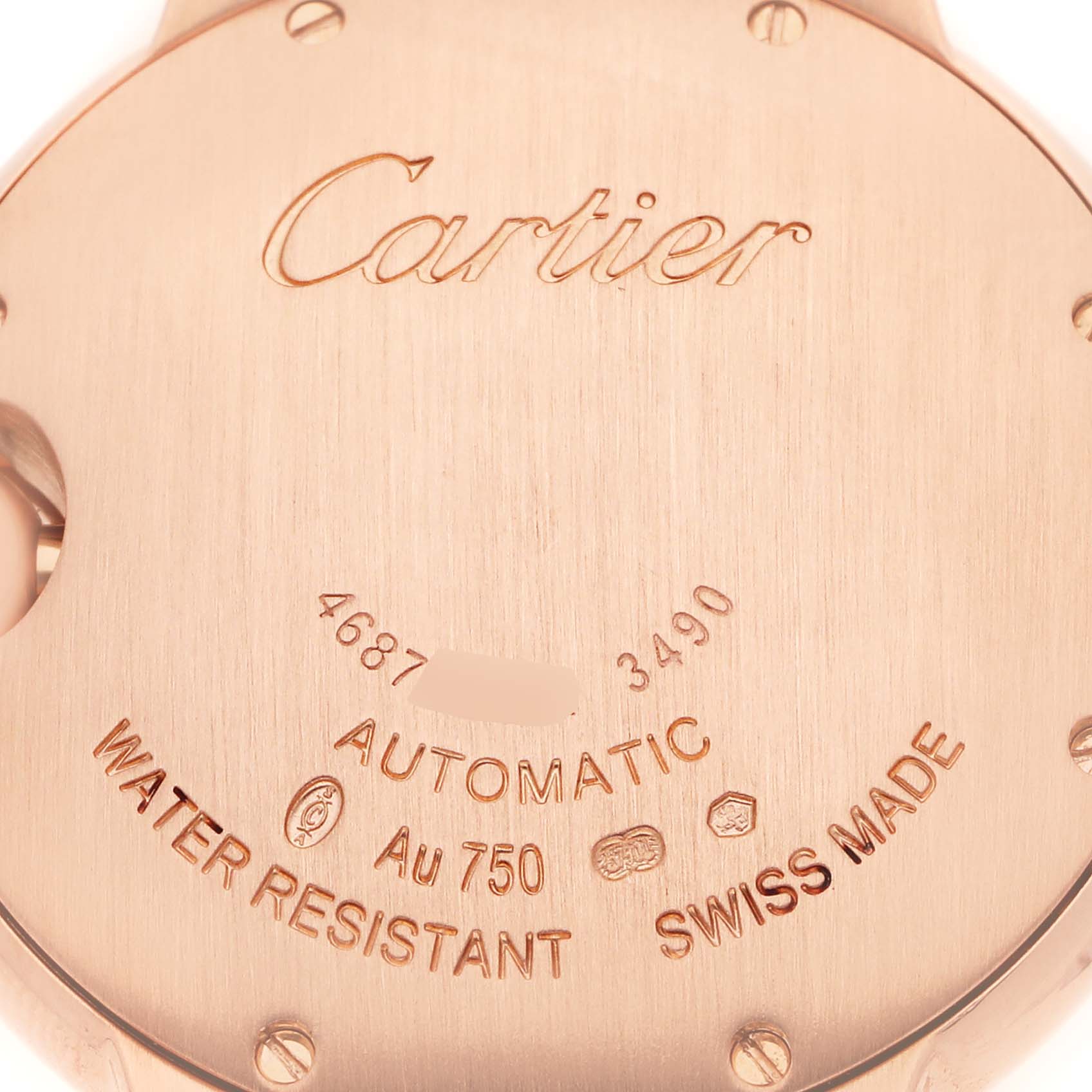 The image shows the back of the Cartier Ballon Bleu men's watch, model number WE902034, highlighting details like "Automatic," "Water Resistant," and "Swiss Made."