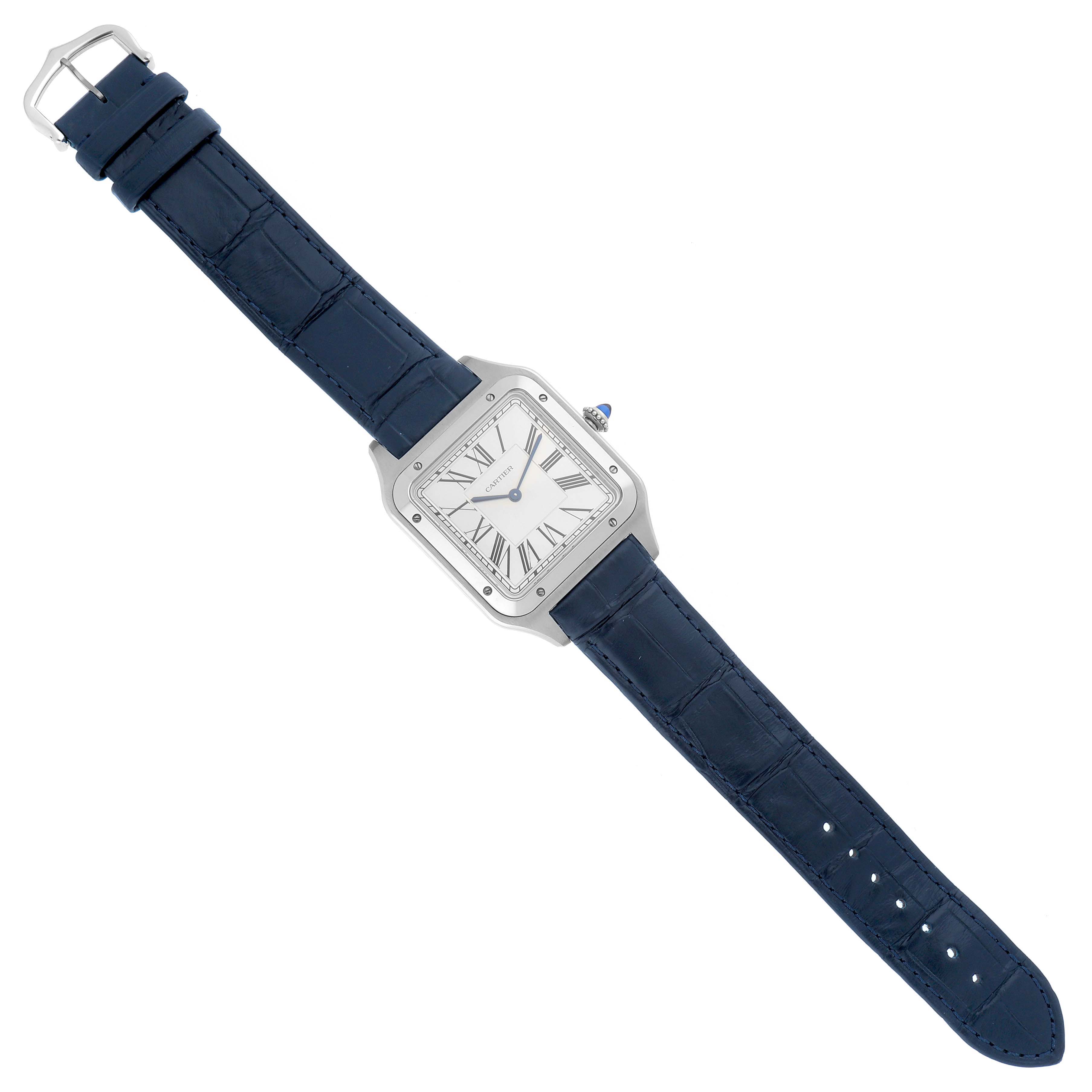 The Cartier Santos Dumont model WSSA0032 is shown from a top-down angle, displaying the full watch including its square case, white dial, and blue leather strap.