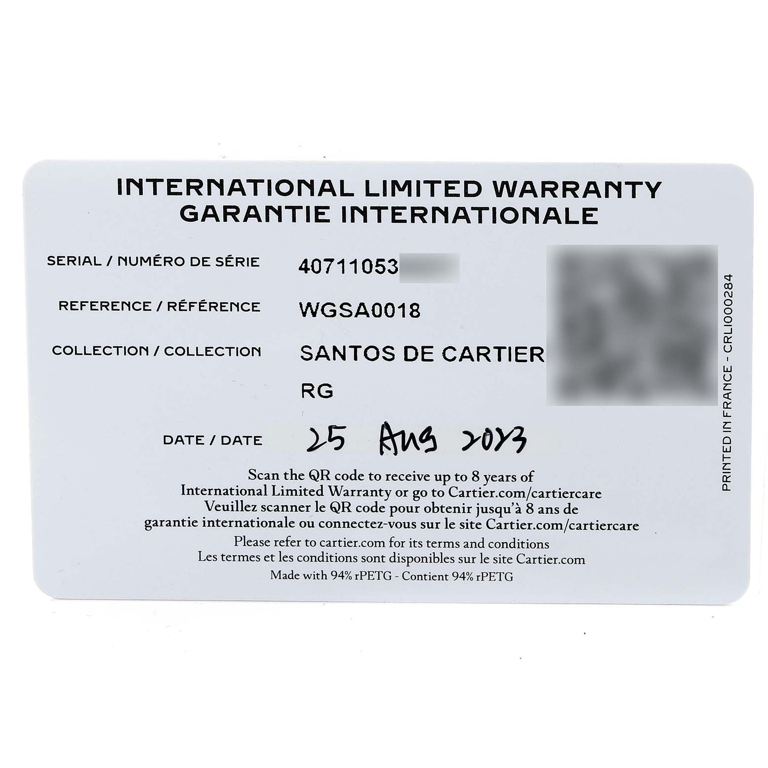 This is an image of the international limited warranty card for the Santos de Cartier watch, showing serial and reference numbers, and the date.