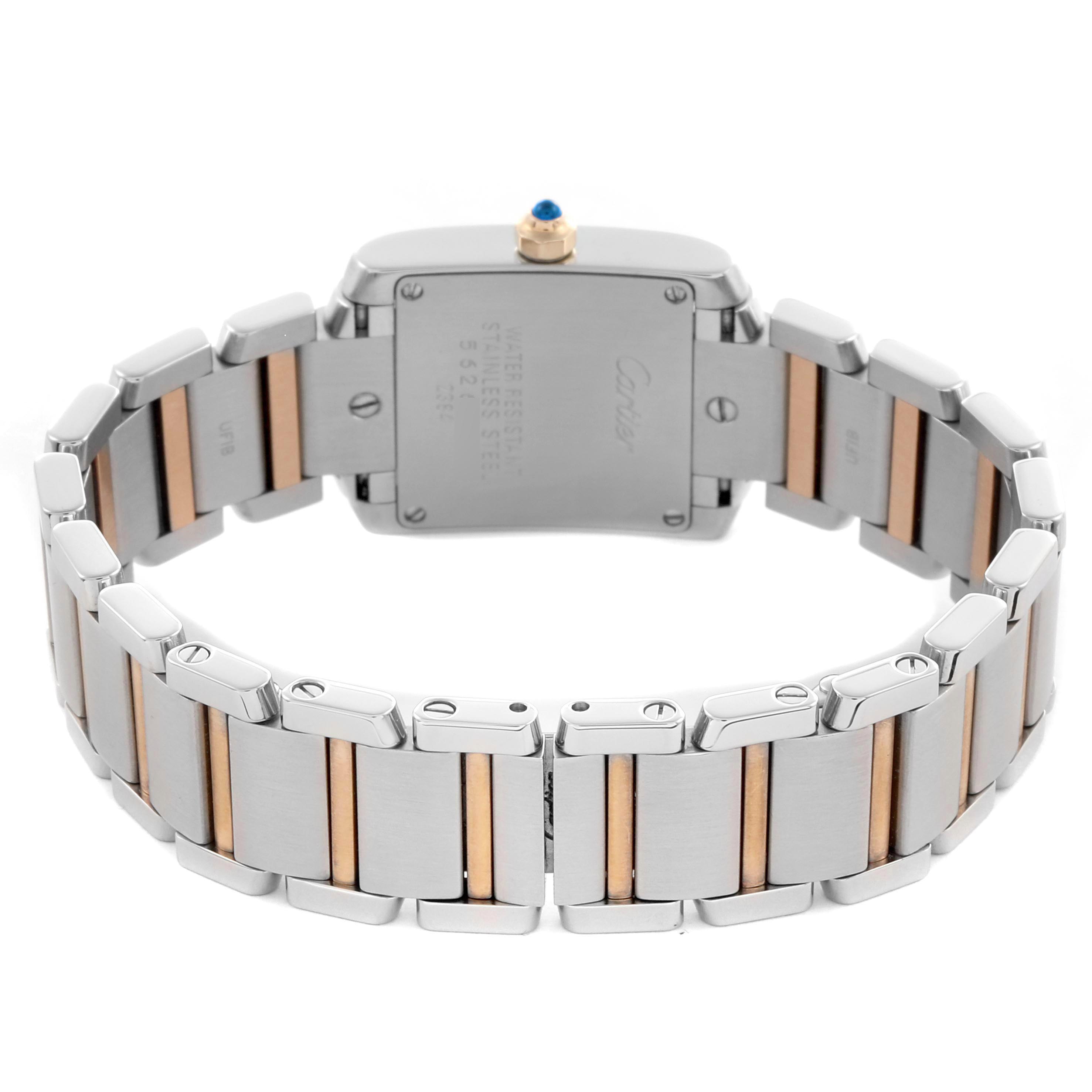 The image shows the back of a Cartier Tank Francaise, model number W51027Q4, highlighting the stainless steel and gold bracelet and the back casing of the watch.