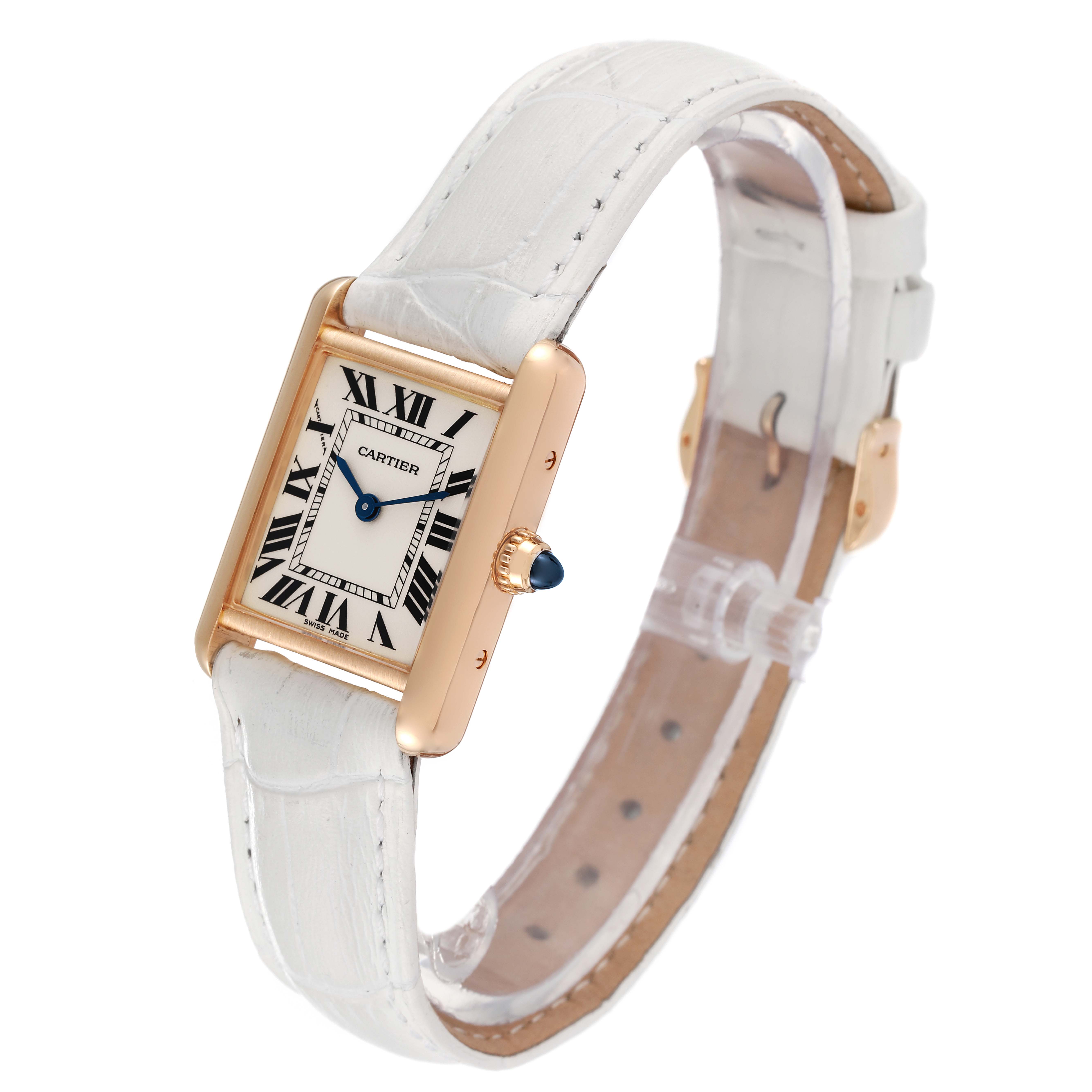 The image shows a Cartier Tank Louis W1529856 Women
s Yellow Gold Silver Dial W1529856 Women
s Yellow Gold Silver Dial watch angled to display the face, strap, and crown with a blue cabochon.