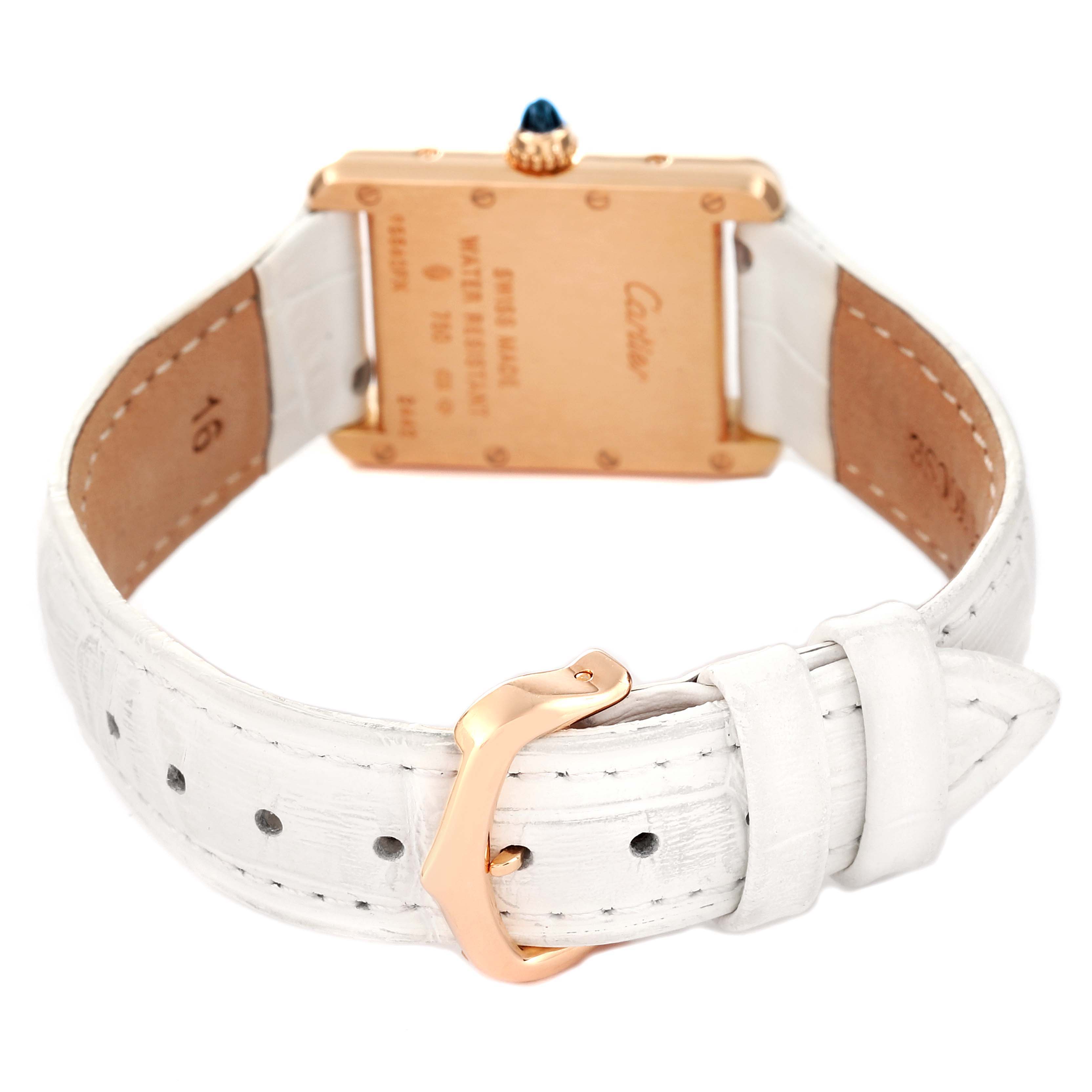 The image shows the back and underside of the Tank Louis watch by Cartier, with its clasp and strap visible.