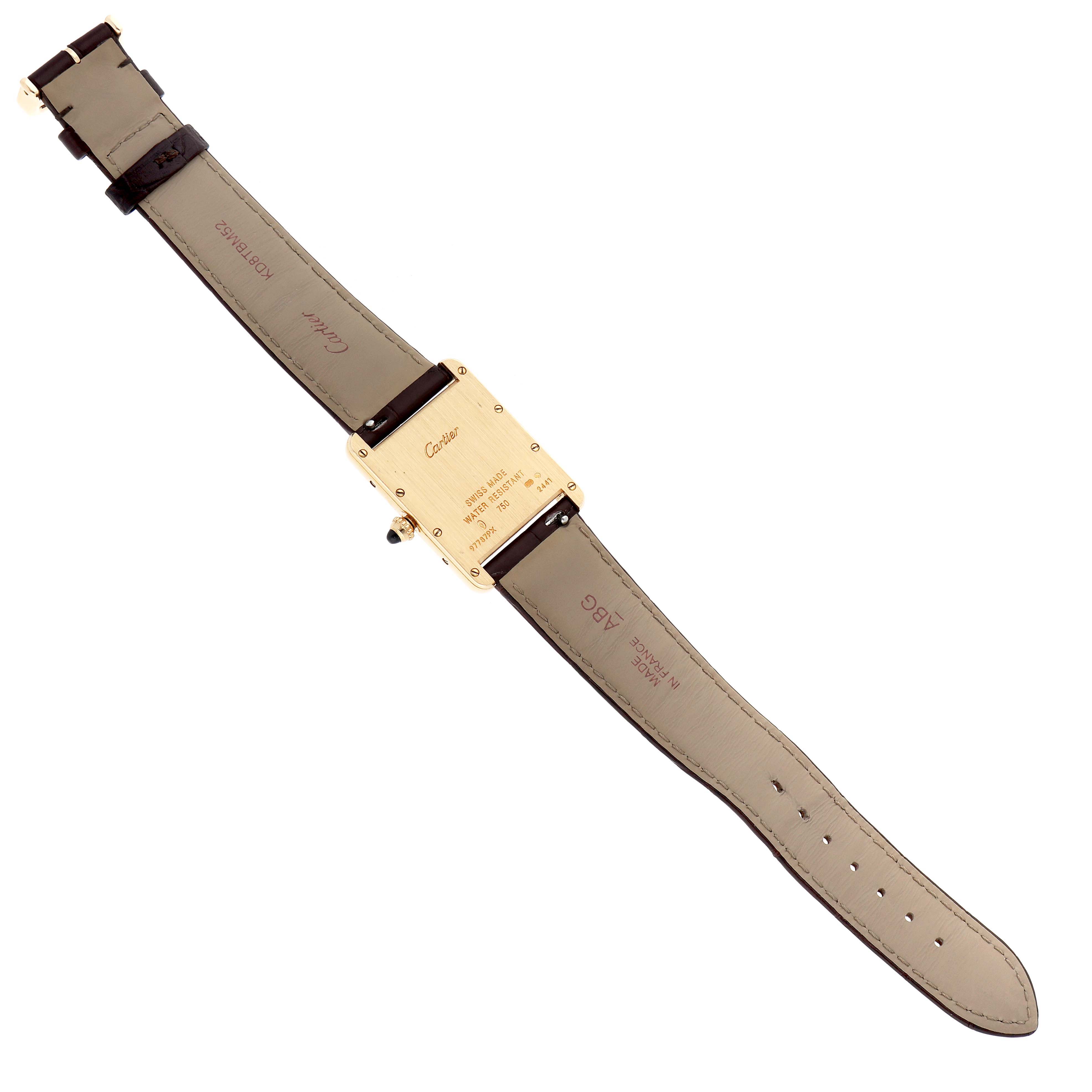 The image shows the back of a Cartier Tank Louis model W1529756 men
s watch, highlighting the case back, strap, and clasp from a top-down angle.