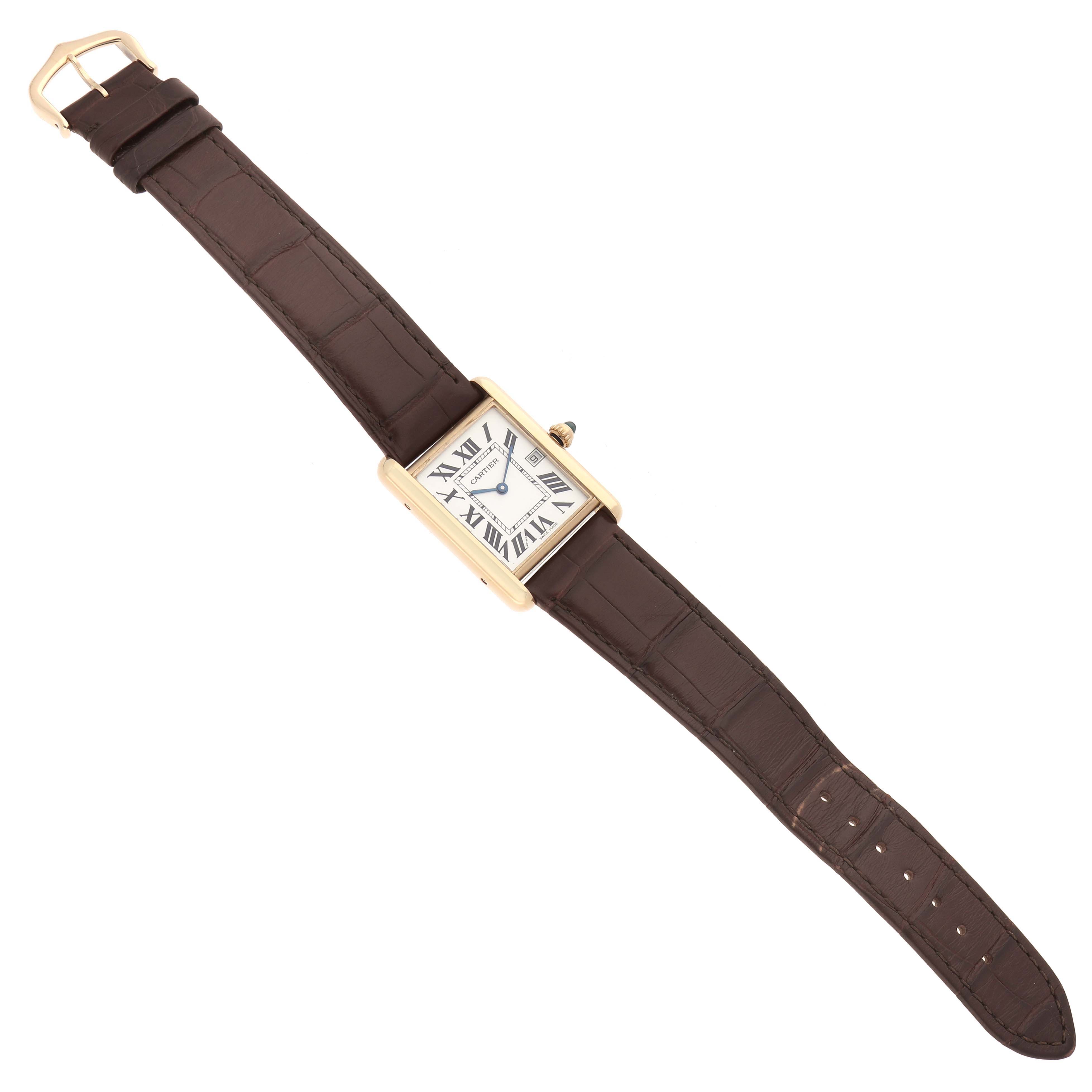 This image shows a Cartier Tank Louis model W1529756 men
s watch from a top-down angle, highlighting its rectangular face, Roman numerals, and brown leather strap.