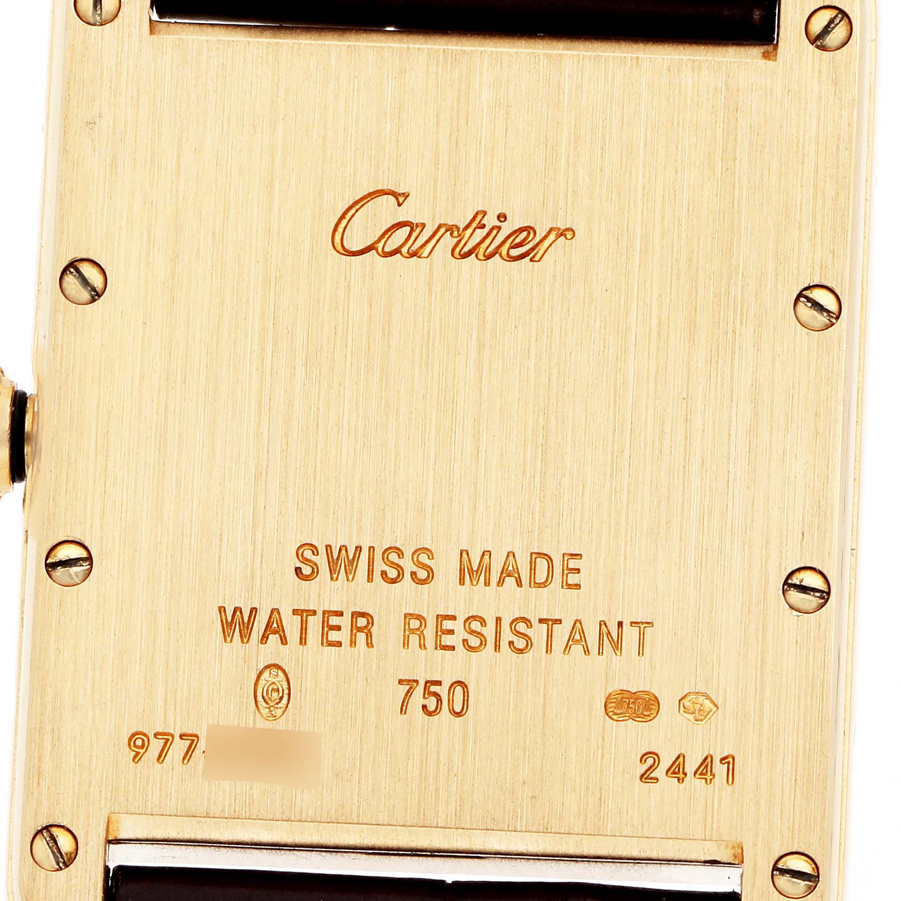 The image shows the back of the Cartier Tank Louis model W1529756, featuring engraved brand details, screws, and embossing indicating water resistance and Swiss origin.