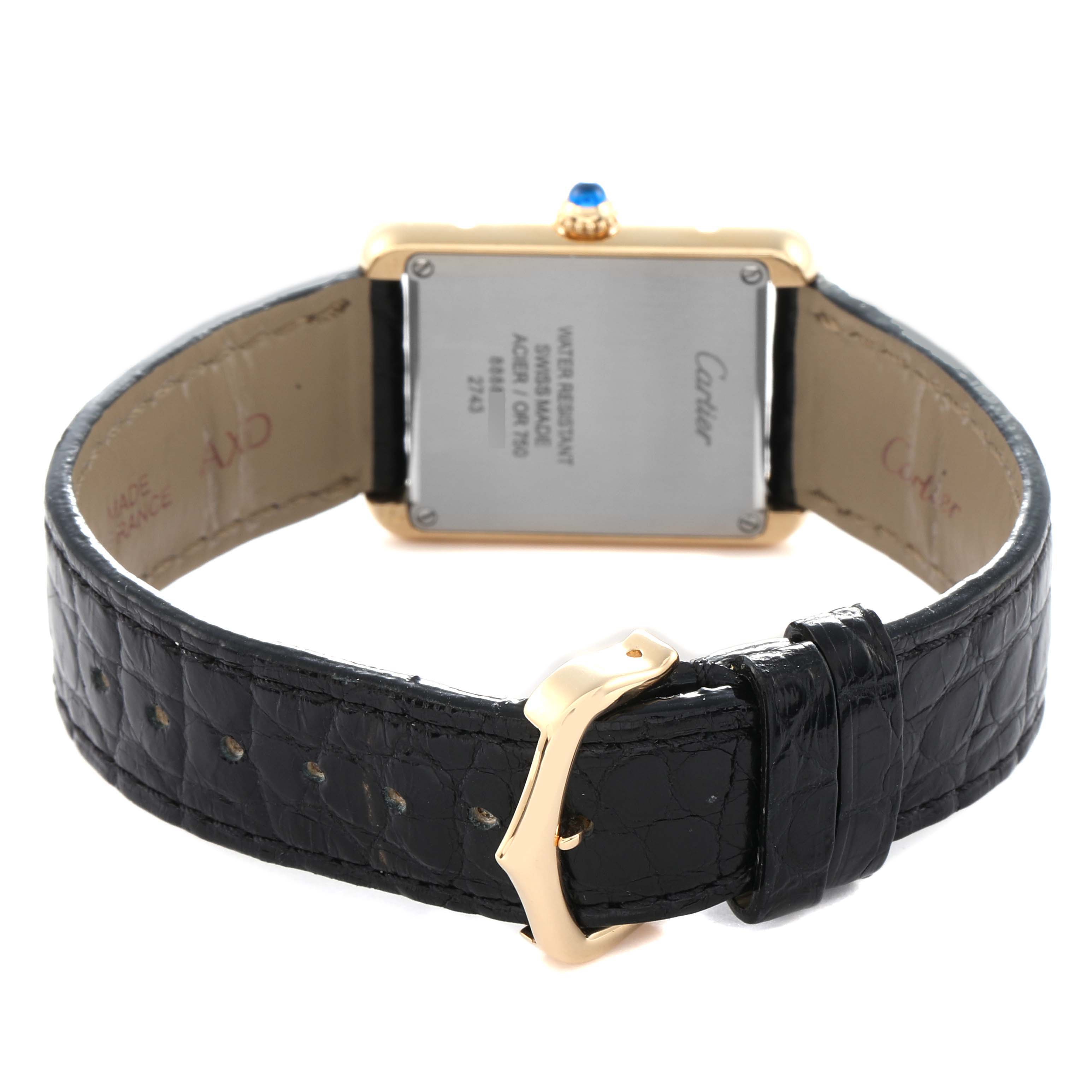 The image shows the back of the Cartier Tank Solo model W1018755 men
s watch, highlighting the case back, strap, and buckle from a rear angle.