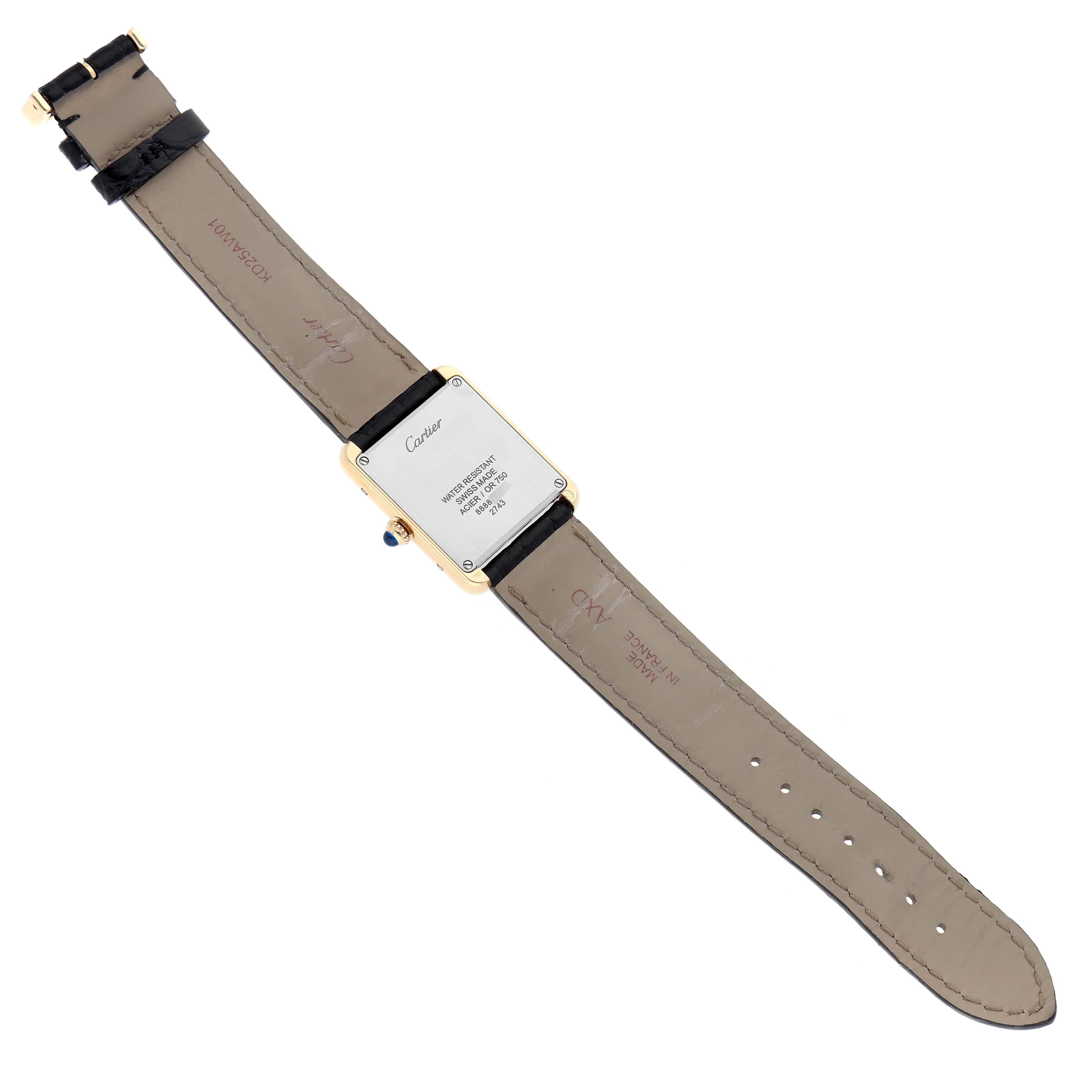 The image shows the back view of the Cartier Tank Solo model W1018755, highlighting the case back, leather strap, and buckle.