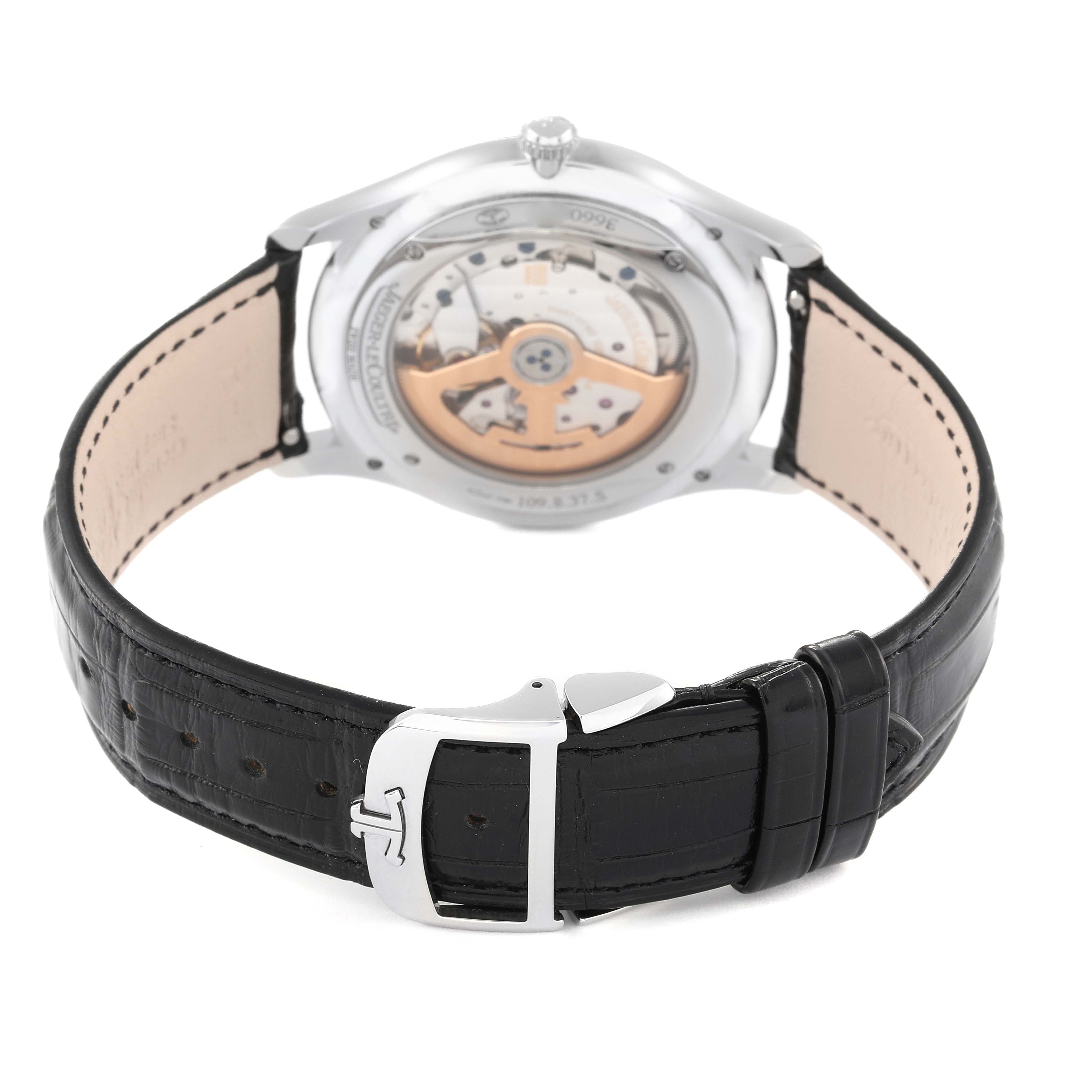 The image shows the back view of a Jaeger-LeCoultre Master model watch with its movement and black leather strap visible.