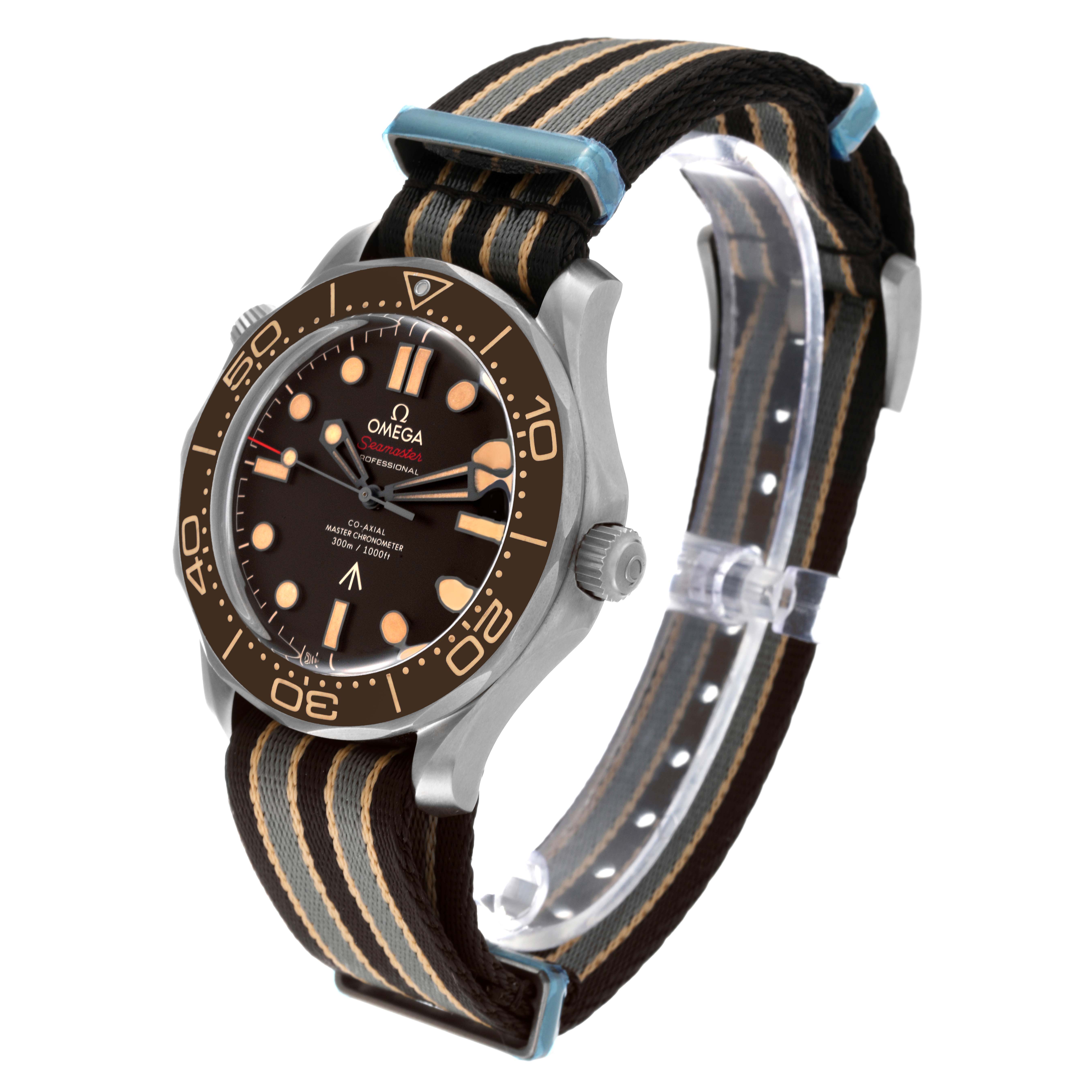 The image shows a side angle of the Omega Seamaster 210.92.42.20.01.001 Men's Titanium Brown Dial 210.92.42.20.01.001 Men's Titanium Brown Dial watch, highlighting its face, bezel, crown, and striped fabric strap.