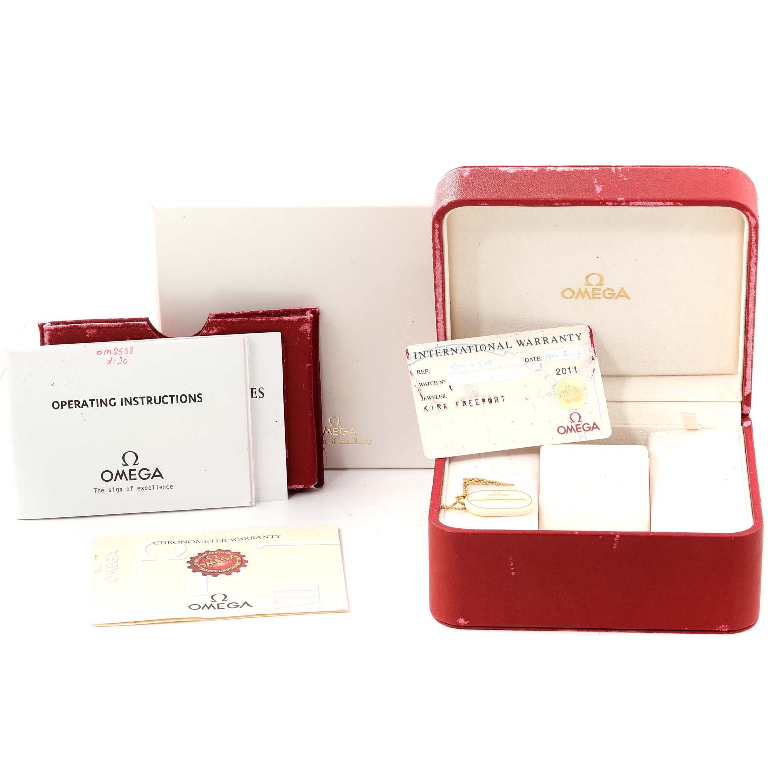 The image shows the accessories for an Omega Seamaster 2538.20.00 Men's Stainless Steel White Dial 2538.20.00 Men's Stainless Steel White Dial, including the box, international warranty card, and operating instructions.