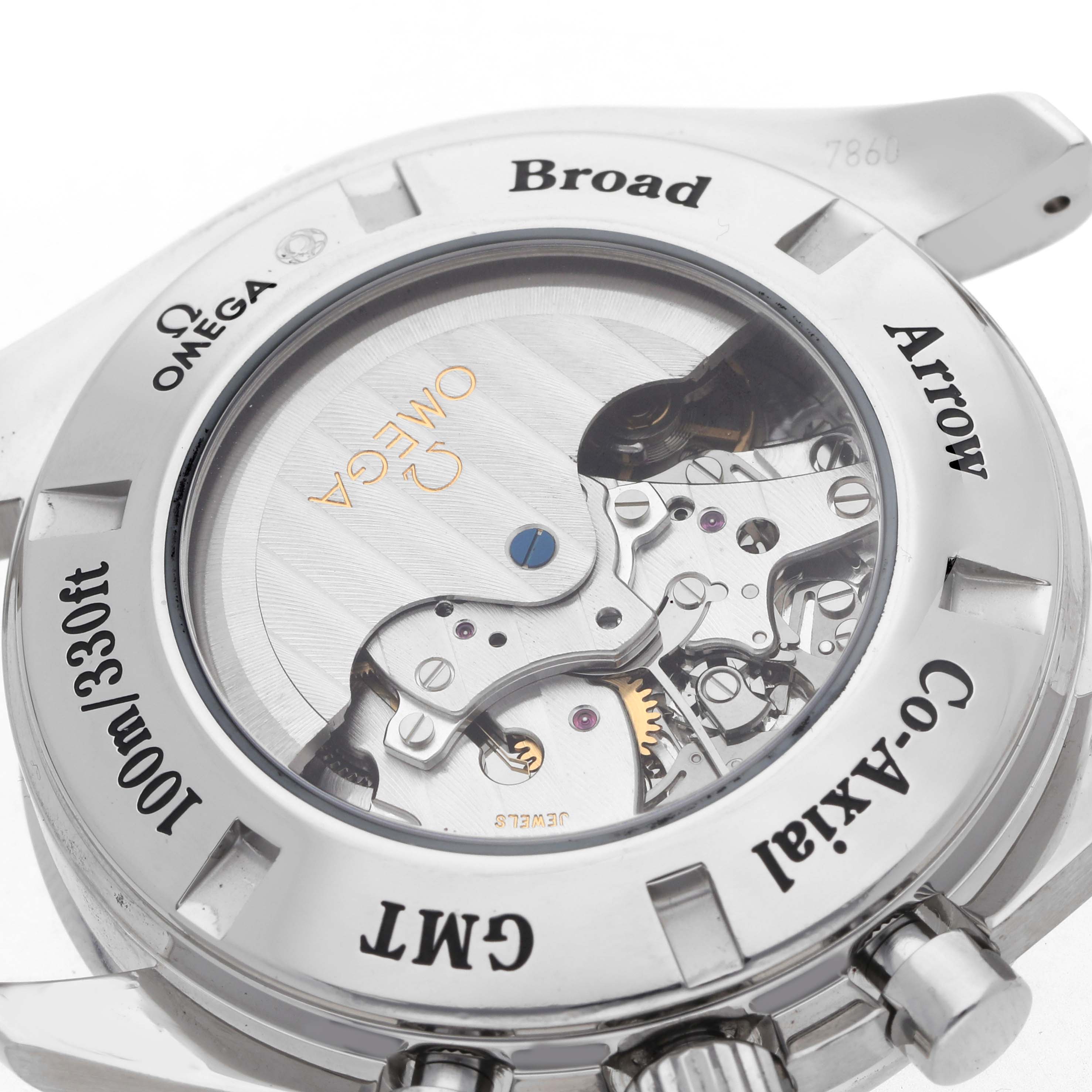 The image shows the case back of an Omega Speedmaster model number 3581.50.00, highlighting the movement through a transparent back and engravings on the metal.