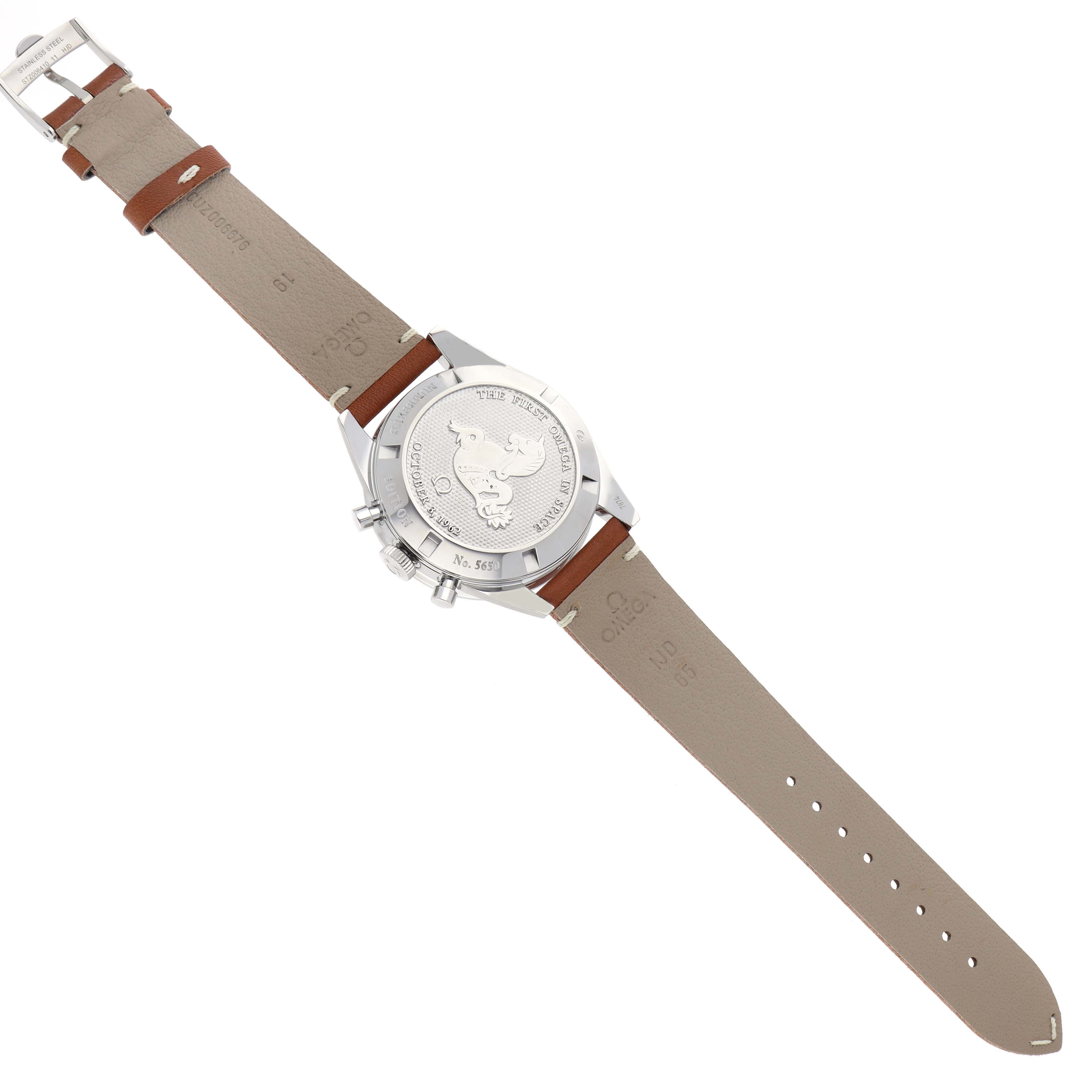 The image shows the back view of an Omega Speedmaster, model 311.32.40.30.01.001, highlighting the case back, pushers, and leather strap.