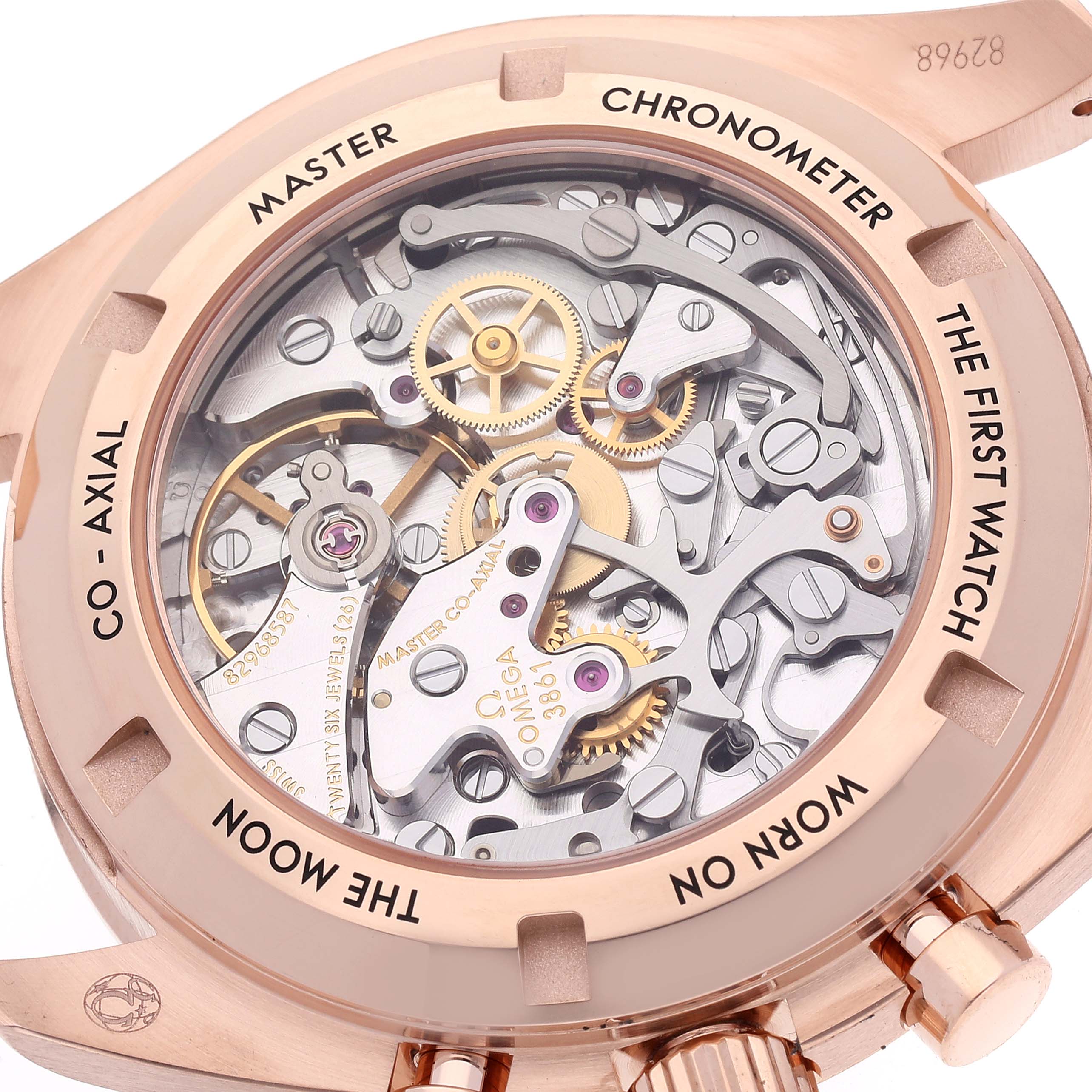 The image shows the case back of the Omega Speedmaster 310.63.42.50.02.001 Men's Rose Gold Black Dial 310.63.42.50.02.001 Men's Rose Gold Black Dial watch, highlighting its intricate automatic movement components.