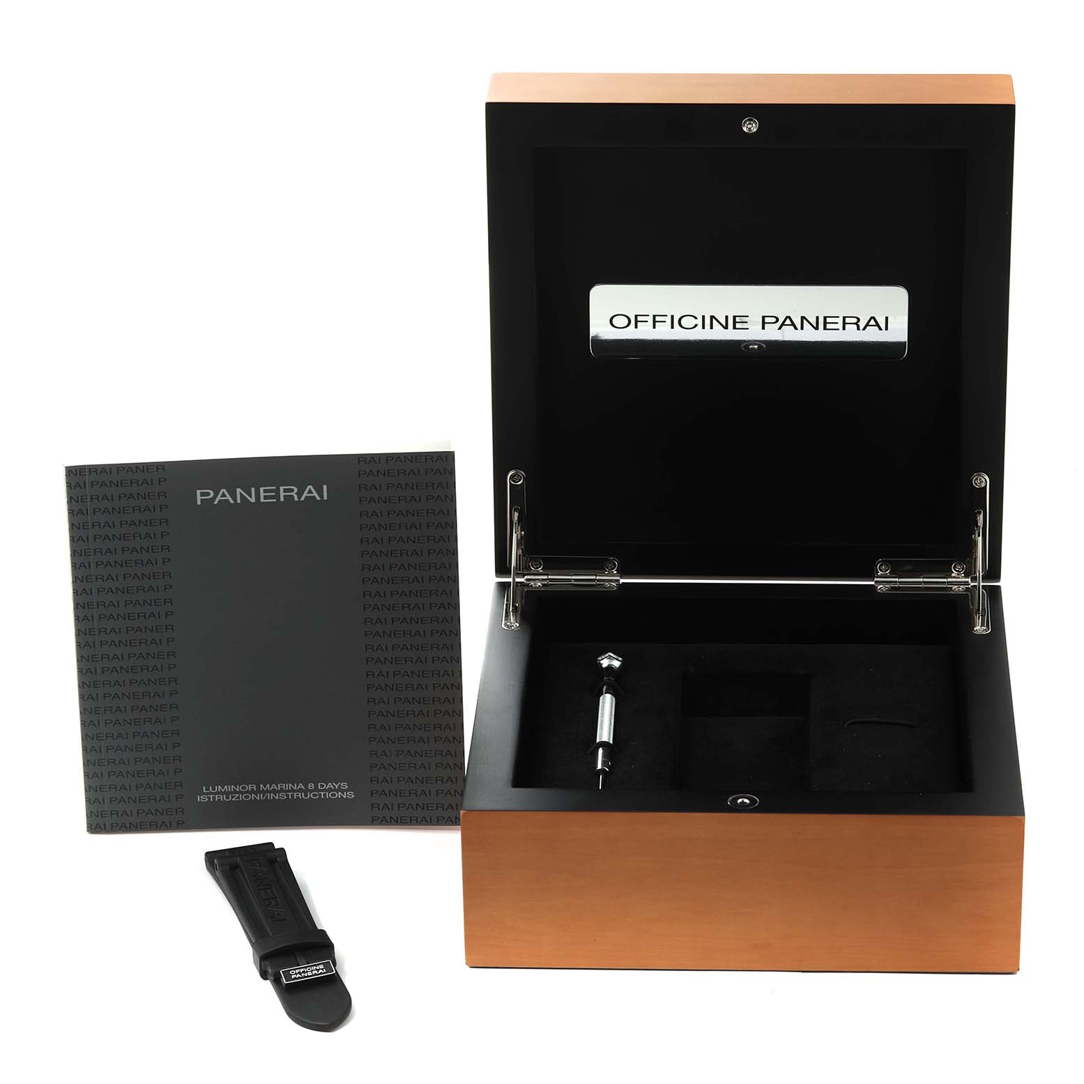 This image shows the open box, manual, and spare leather strap of a Panerai Luminor PAM00564 Men
s Stainless Steel Black Dial PAM00564 Men
s Stainless Steel Black Dial watch.