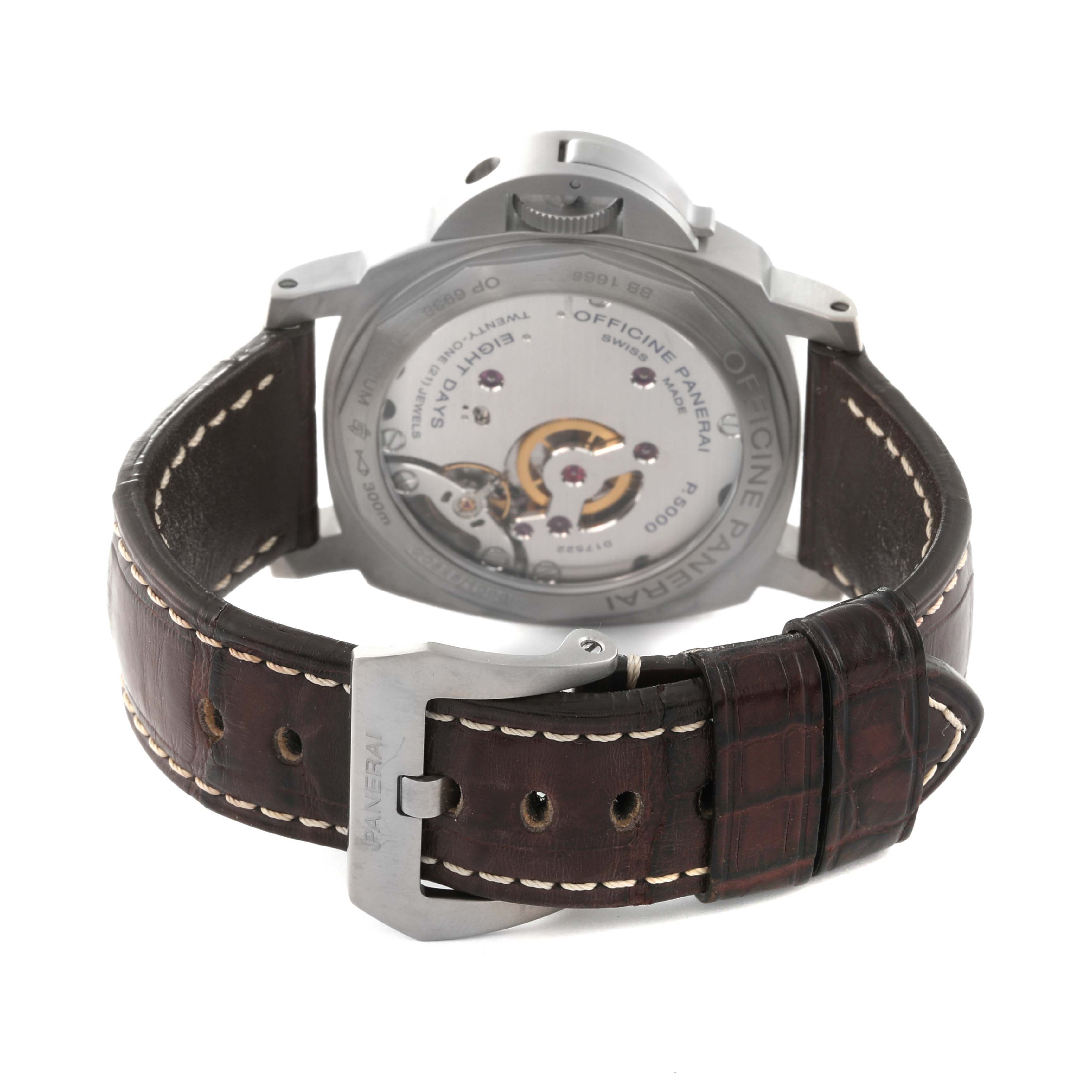 The image shows the back view of a Panerai Luminor PAM00564 Men
s Stainless Steel Black Dial PAM00564 Men
s Stainless Steel Black Dial watch, highlighting the movement and leather strap with a buckle.