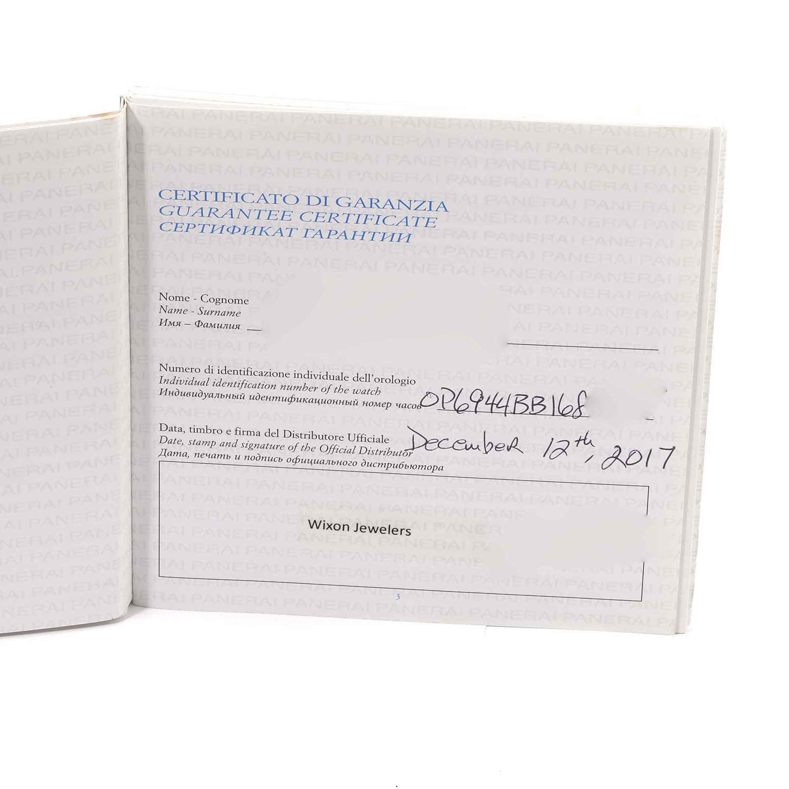 The image shows a guarantee certificate for a Panerai Radiomir PAM00515 Men's Rose Gold Brown Dial PAM00515 Men's Rose Gold Brown Dial watch, focusing on the open booklet with handwritten details.