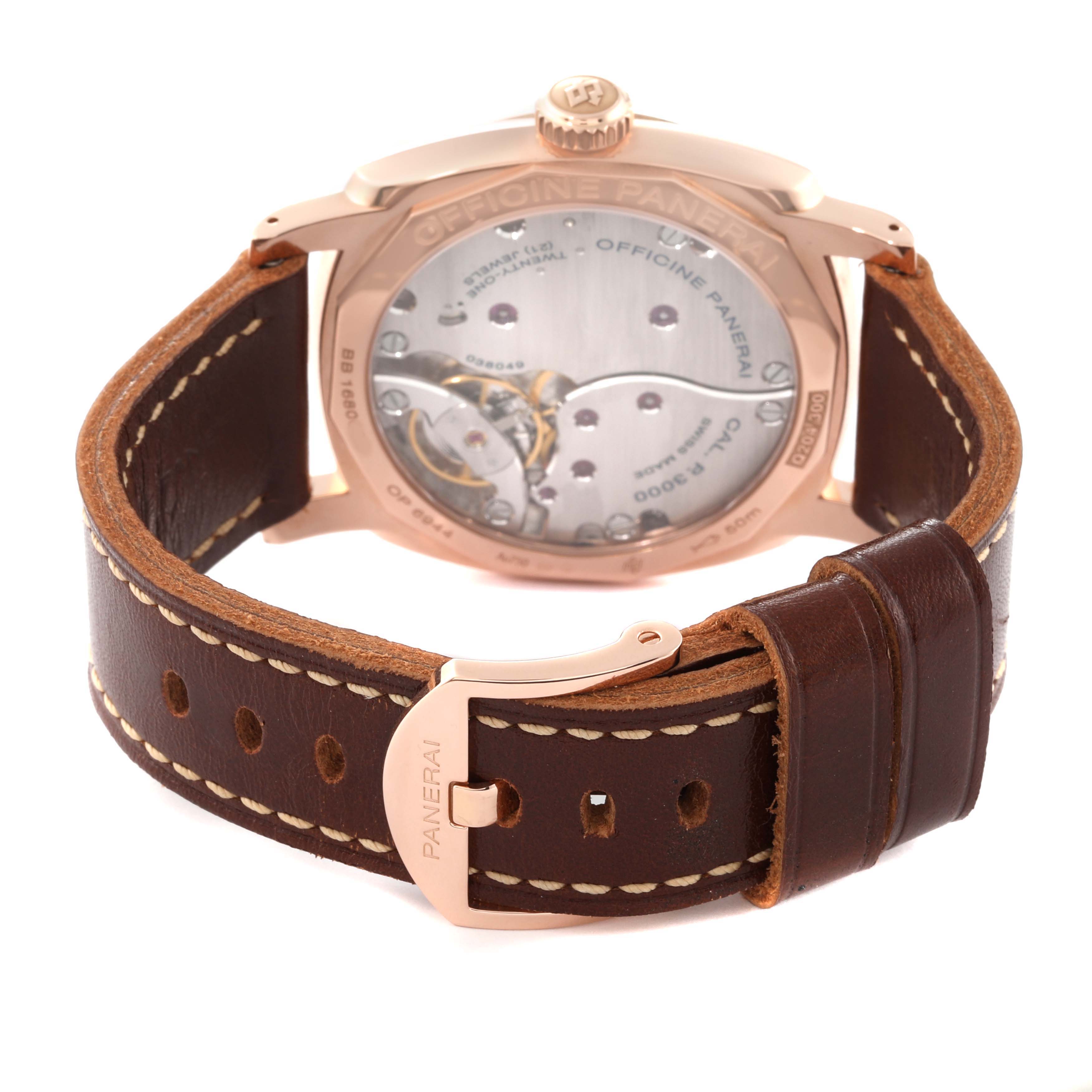 The image shows the back of a Panerai Radiomir PAM00515 Men's Rose Gold Brown Dial PAM00515 Men's Rose Gold Brown Dial watch, highlighting the movement through a transparent case back and a leather strap with a branded buckle.