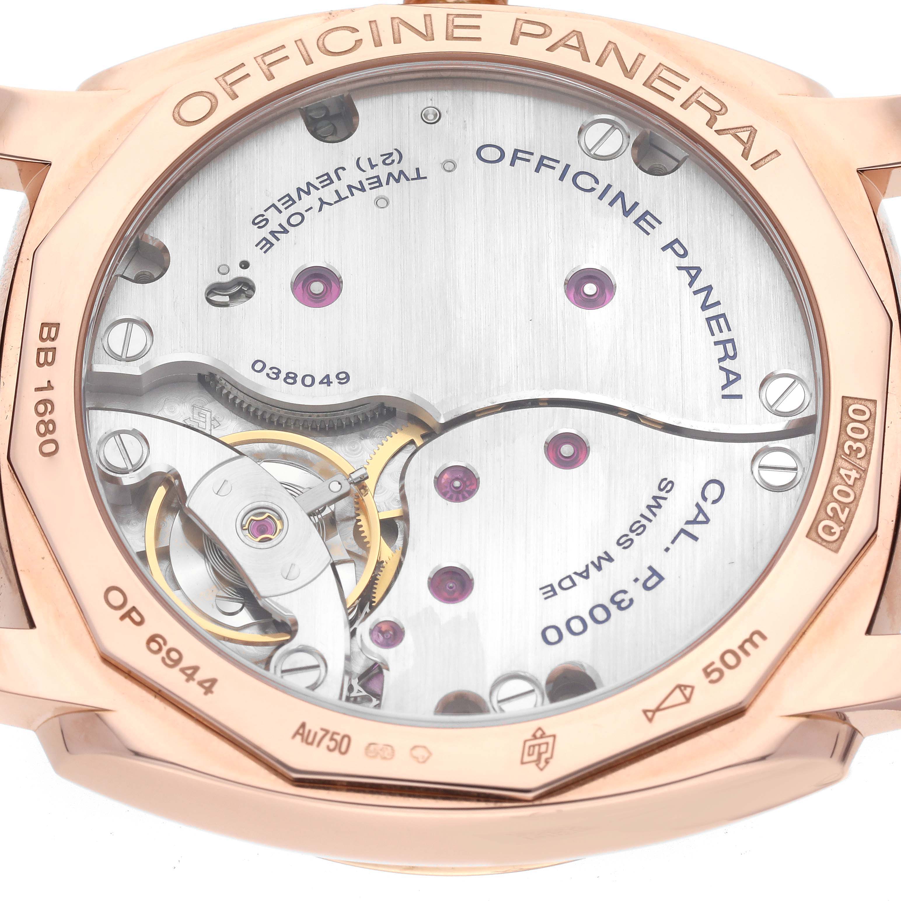 The image shows the back view of a Panerai Radiomir PAM00515 Men's Rose Gold Brown Dial PAM00515 Men's Rose Gold Brown Dial watch, showcasing the internal mechanics and engravings.