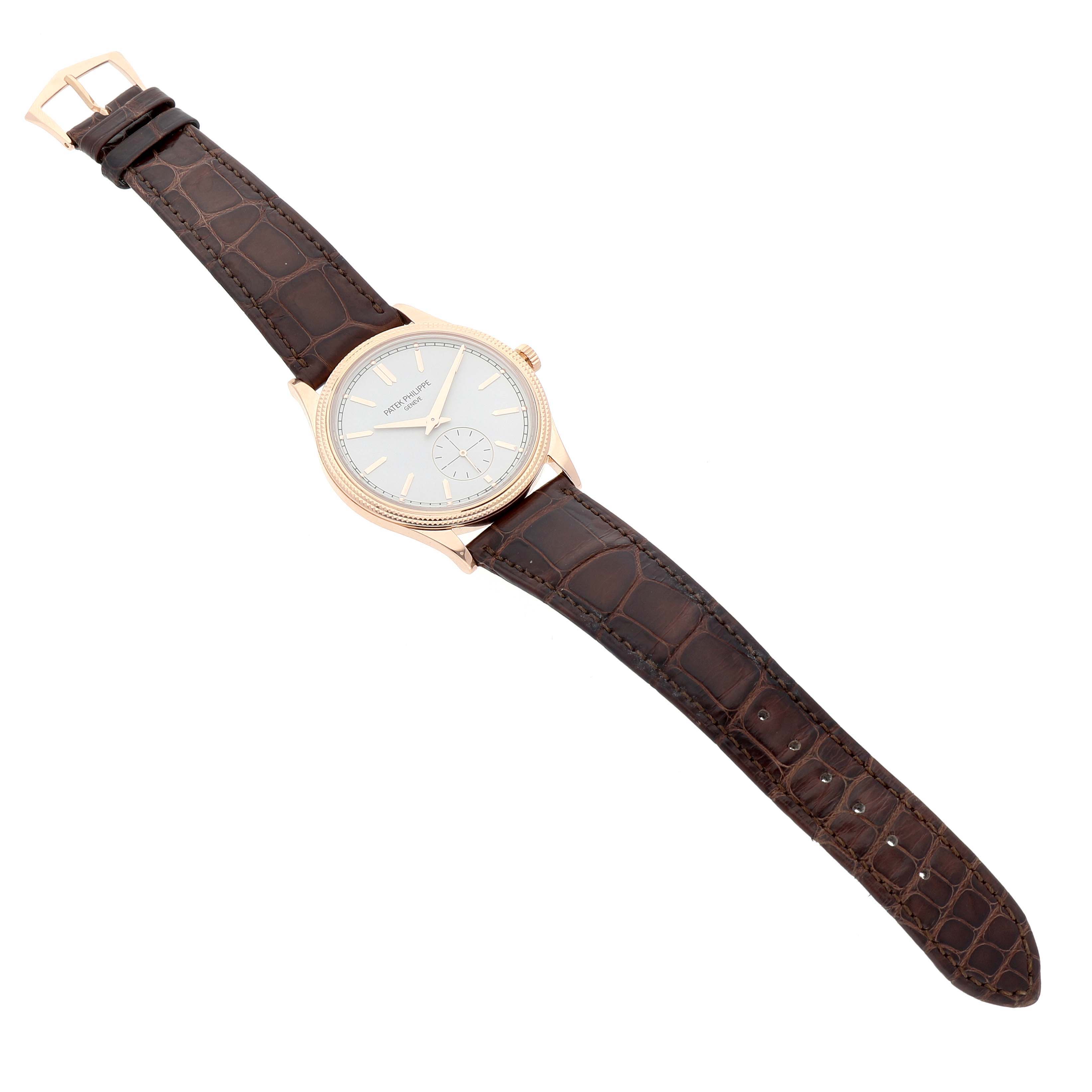 The Patek Philippe Calatrava 6119R-001 Men's Rose Gold Silver Dial watch is shown from an angled top view, highlighting the dial, bezel, and leather strap.
