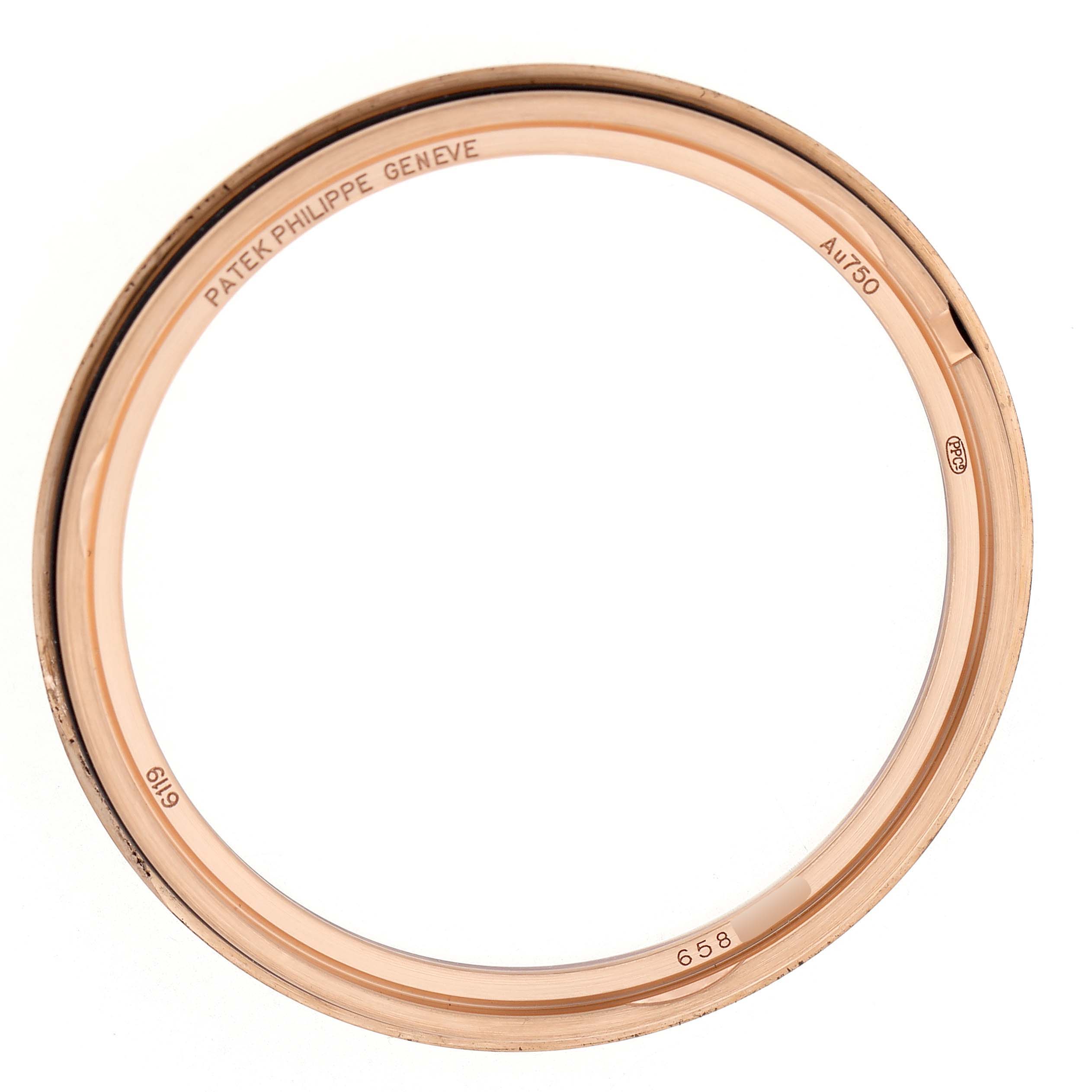 The image shows the bezel of a Patek Philippe Calatrava 6119R-001 Men's Rose Gold Silver Dial watch from a top-down angle.