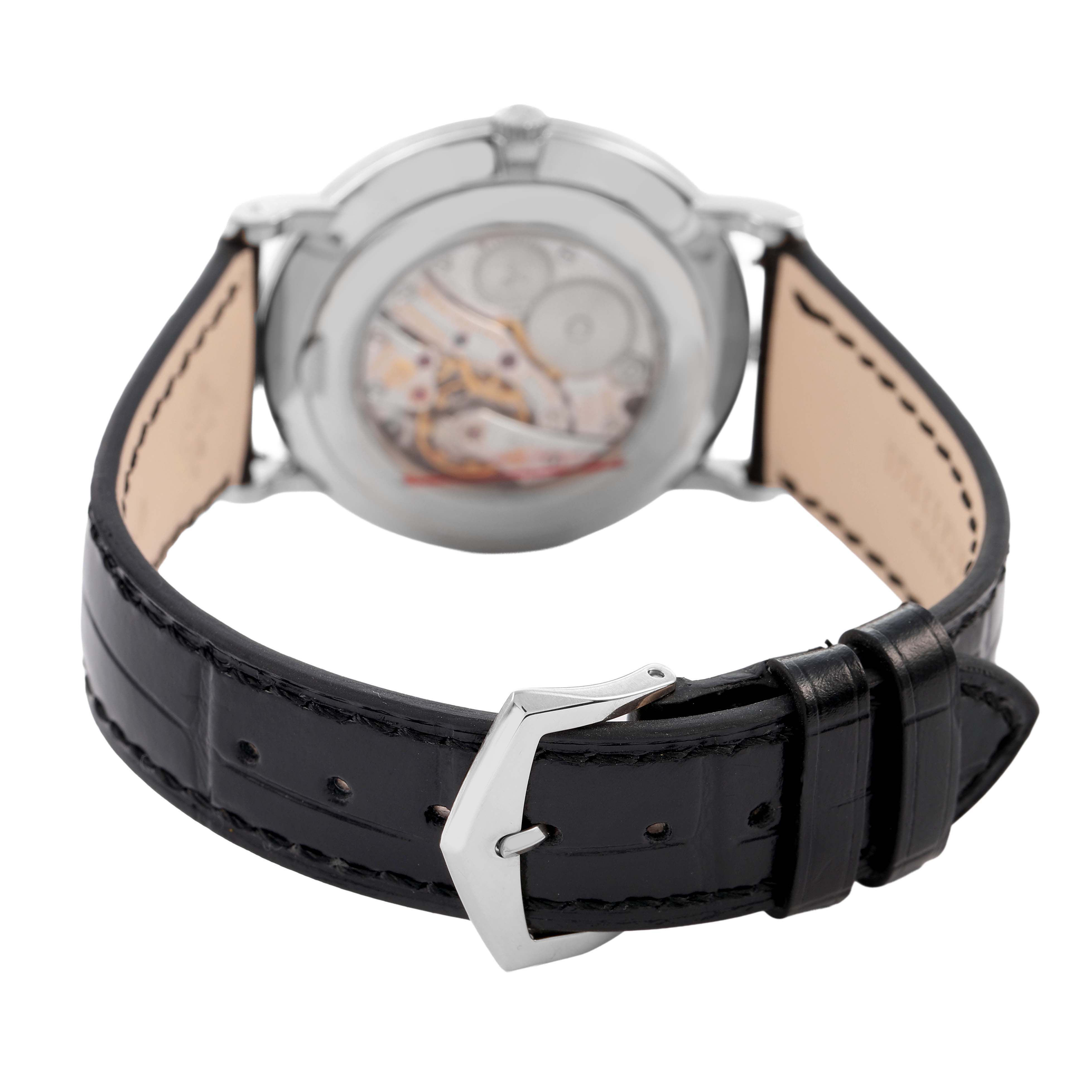 The image shows the back view of the Patek Philippe Calatrava 5116G-001 Men's White Gold White Dial watch, highlighting the leather strap and visible movement through the case back.