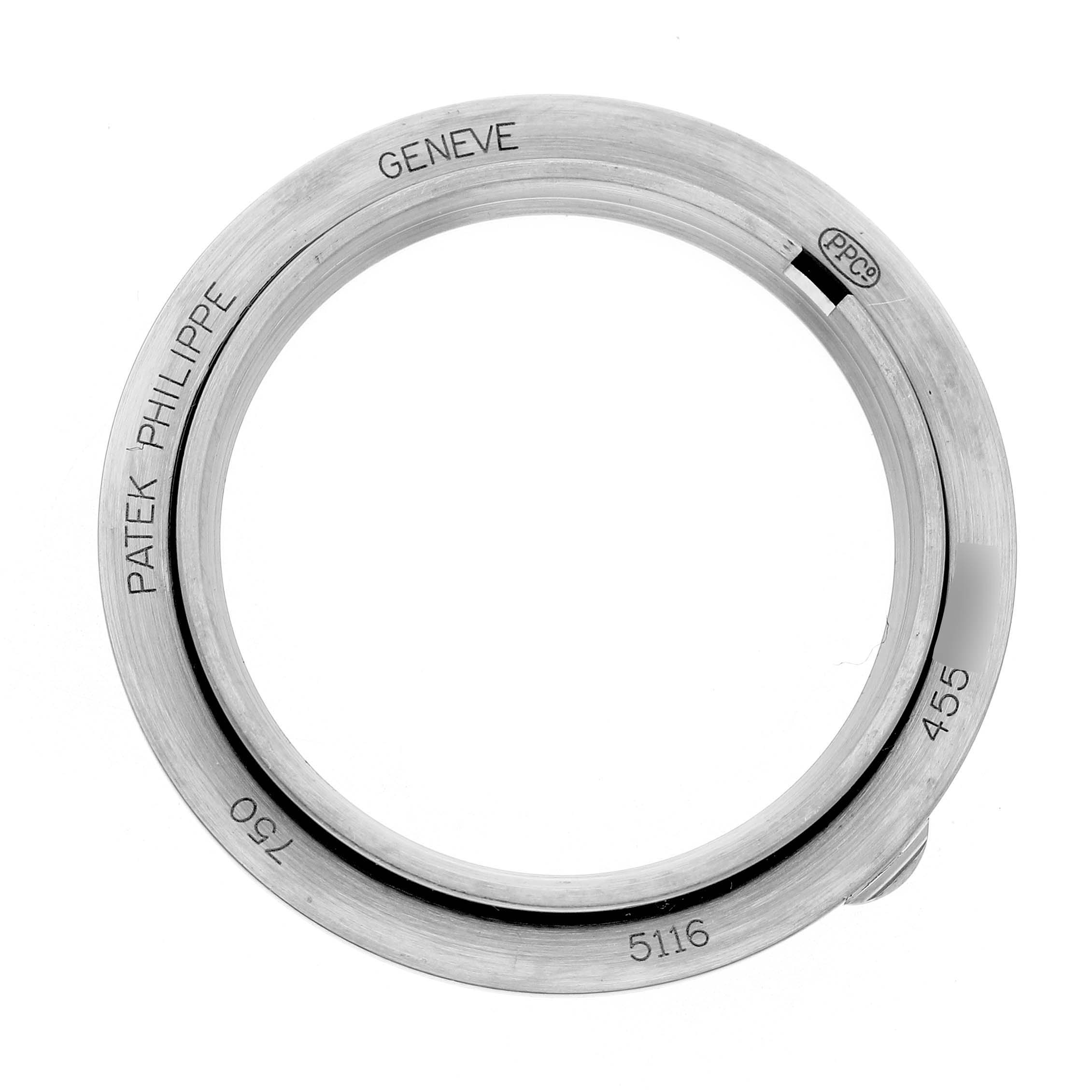The image shows a top-down view of a Patek Philippe Calatrava 5116G-001 Men's White Gold White Dial watch bezel component with engravings.