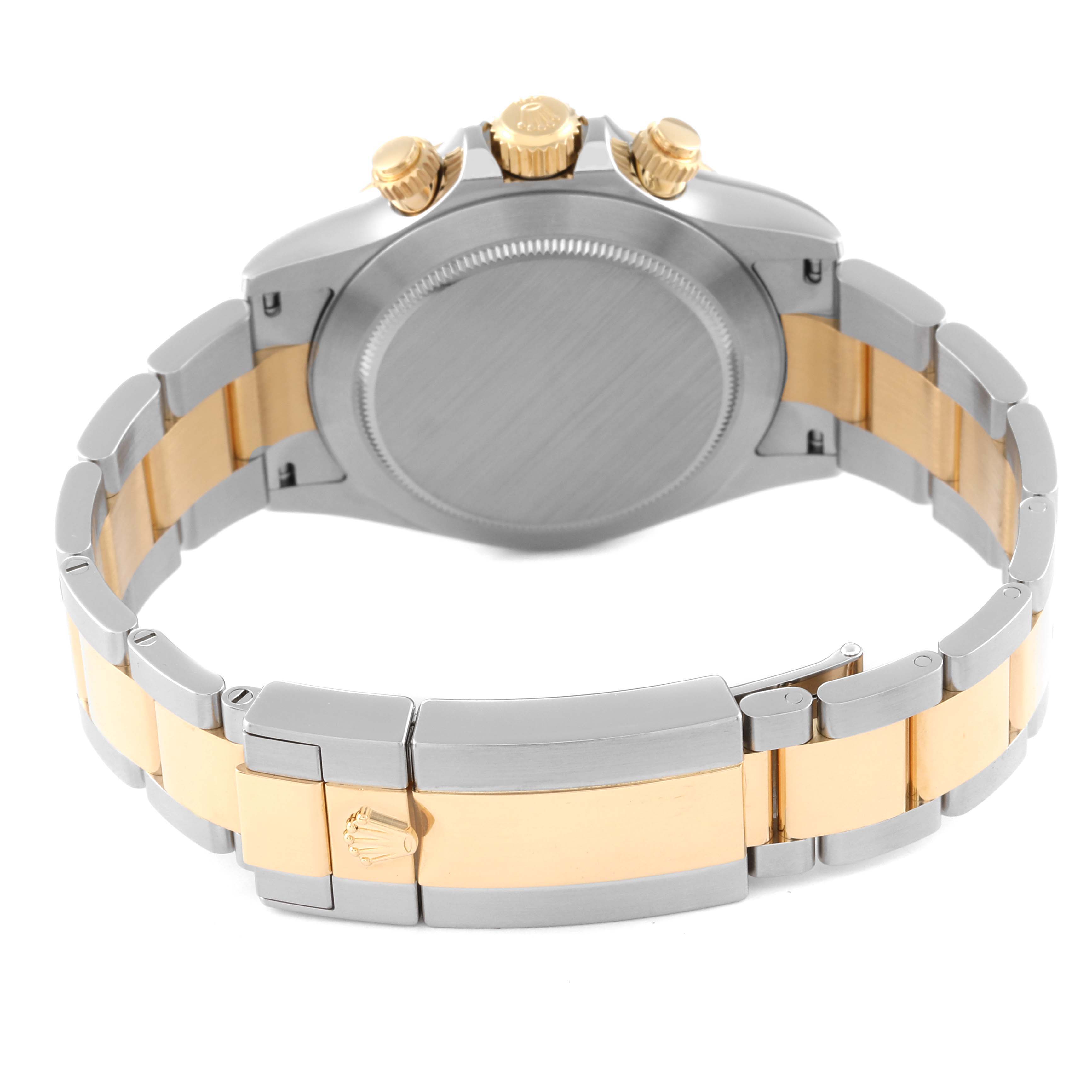 The image shows the back case, crown, and bracelet clasp of a Rolex Daytona 116503 Men's Steel and Gold (two tone) Champagne Dial 116503 Men's Steel and Gold (two tone) Champagne Dial watch, viewed from the rear.