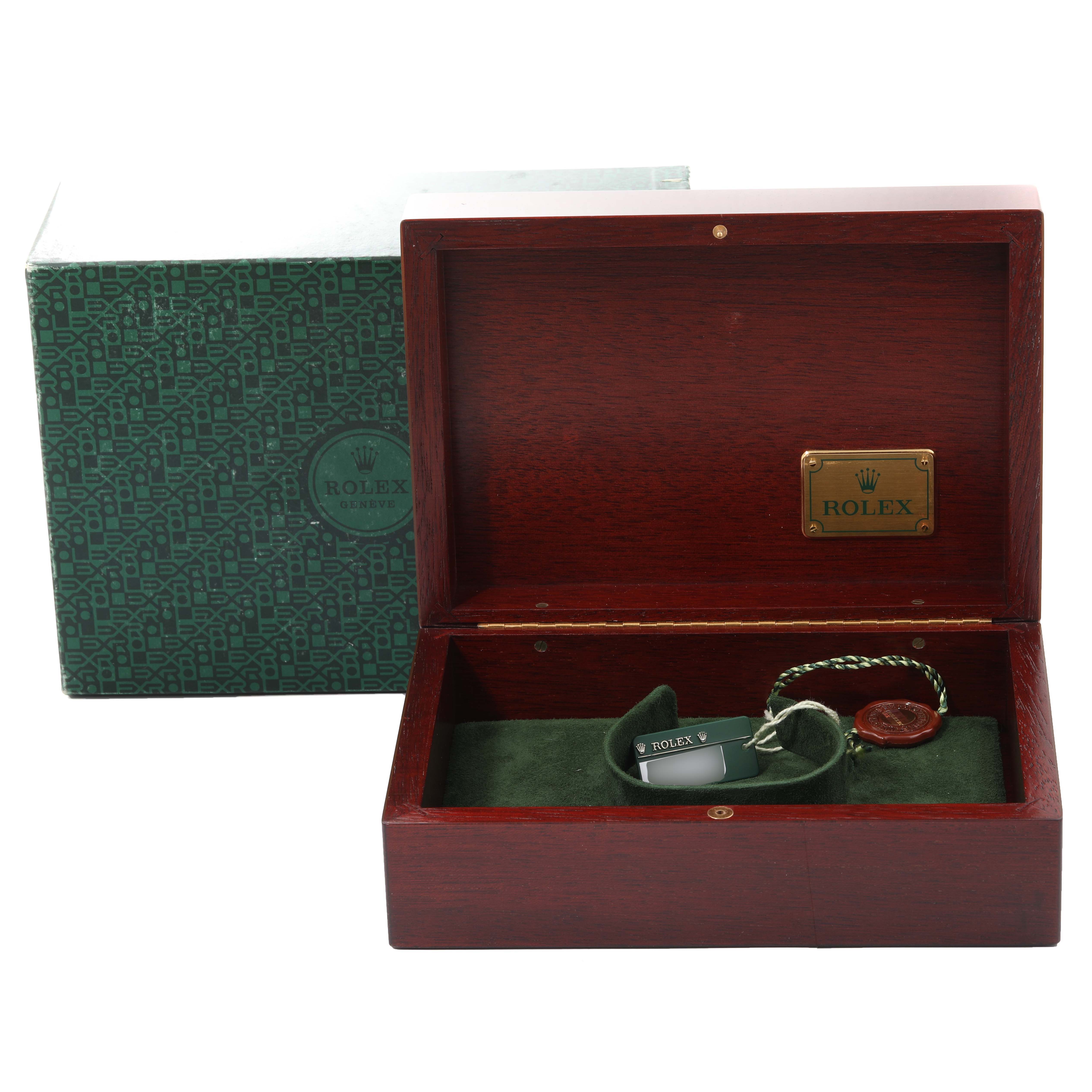 The image shows an open Rolex Daytona 116519 Men
s White Gold Black Dial 116519 Men
s White Gold Black Dial watch box with its accessories and the outer packaging in view.