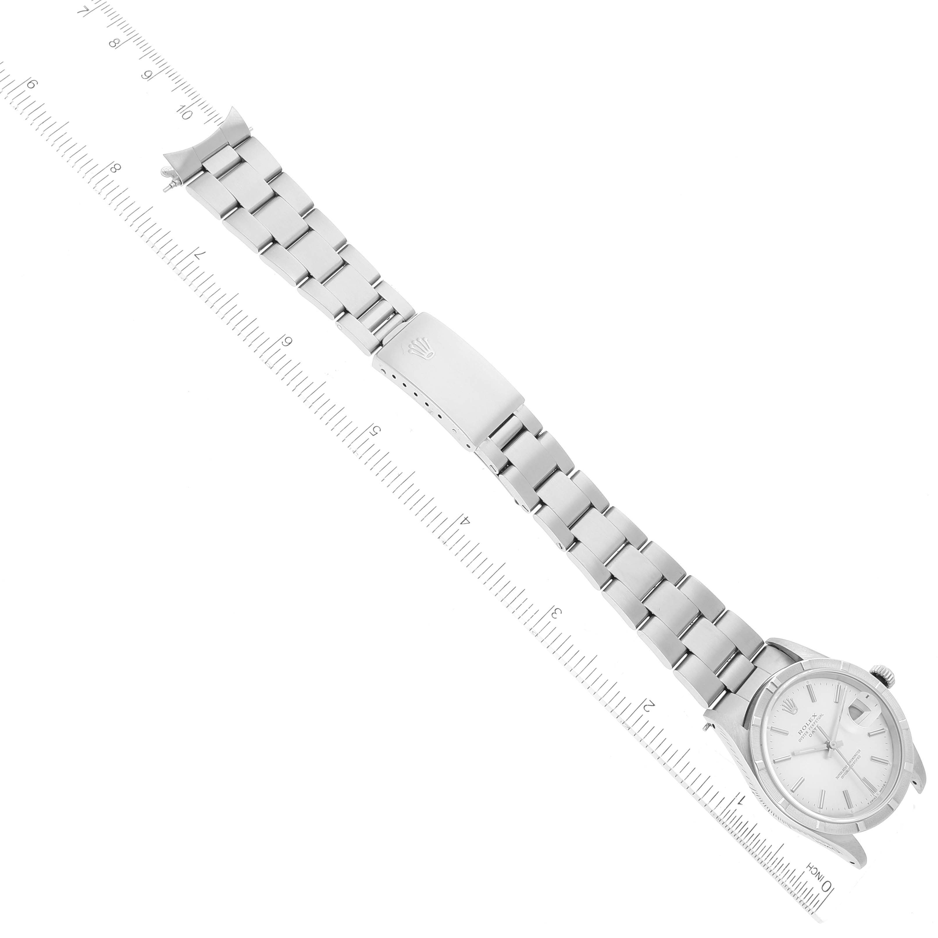 The image shows a top-down view of a Rolex Date 15210 Men's Stainless Steel Silver Dial 15210 Men's Stainless Steel Silver Dial model watch, including its face, bracelet, and clasp.