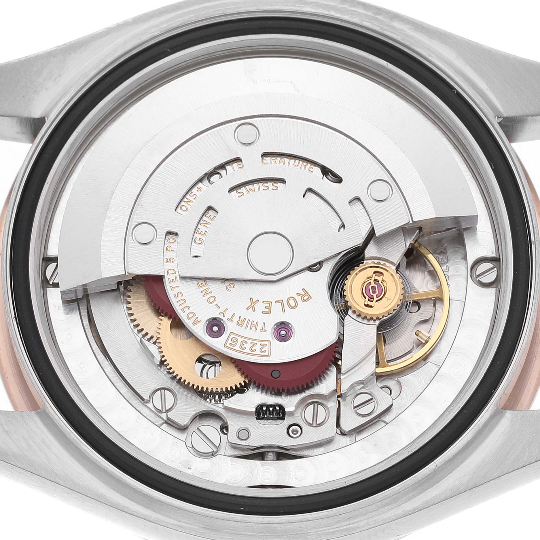 The image shows the Rolex Mid-Size 278271 Women's Steel and Gold (two tone) Grey Dial model movement, focusing on its intricate internal mechanism from the back.