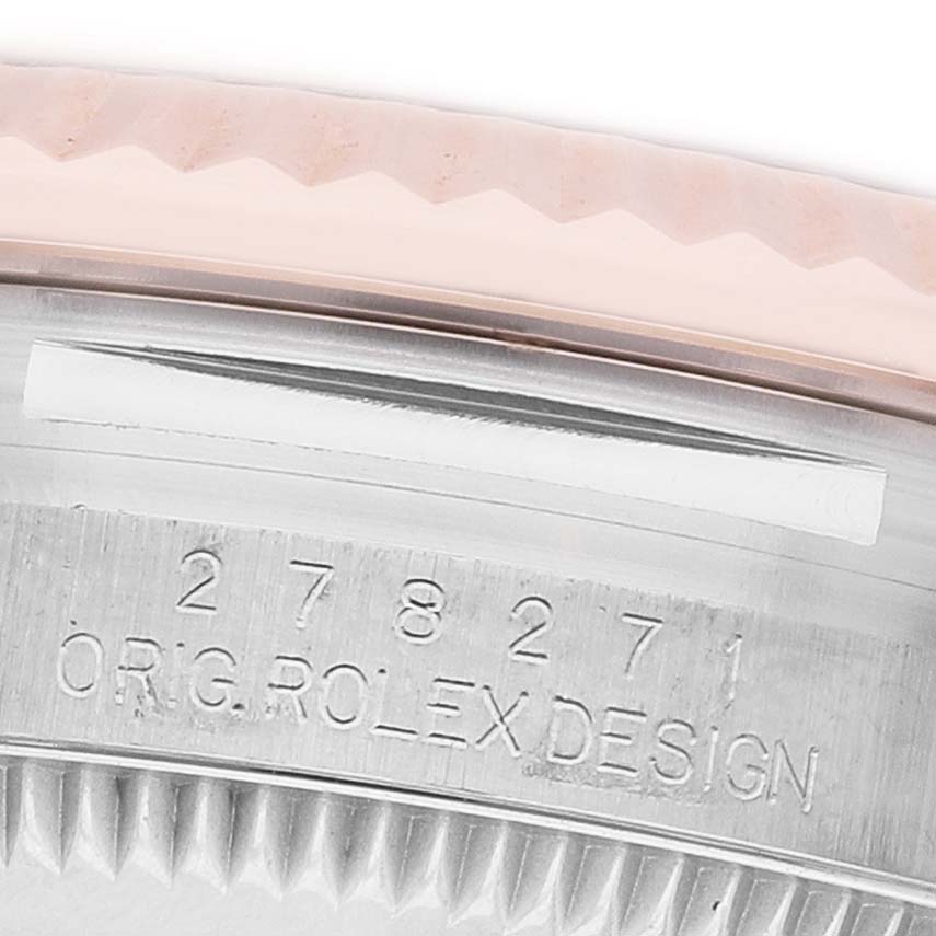 The image shows the side of a Rolex Mid-Size 278271 Women's Steel and Gold (two tone) Grey Dial watch, focusing on the case's engraved model number and design details.